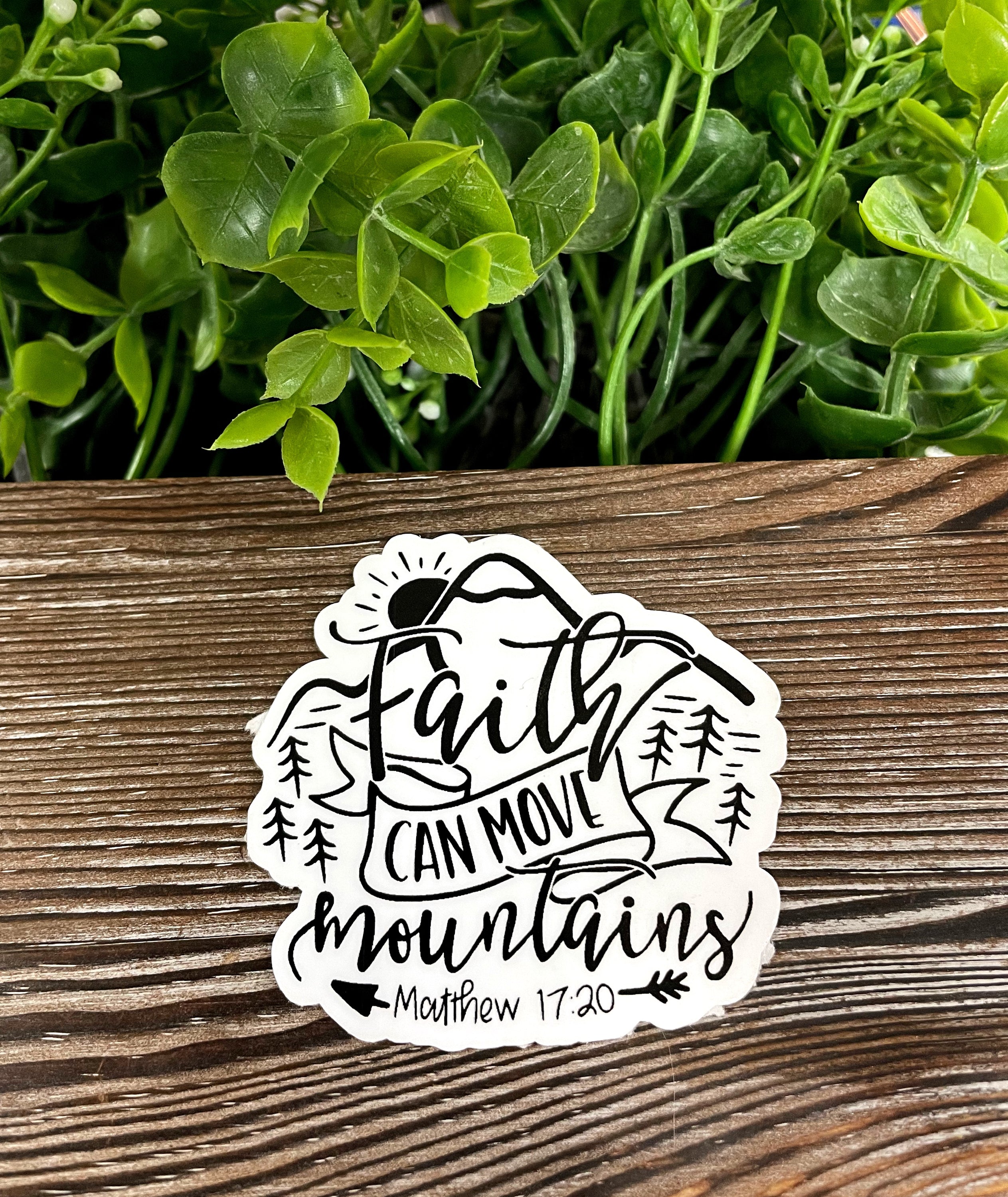 Faith Can Move Mountains sticker featuring inspirational text and vibrant colors, perfect for personalizing various surfaces.