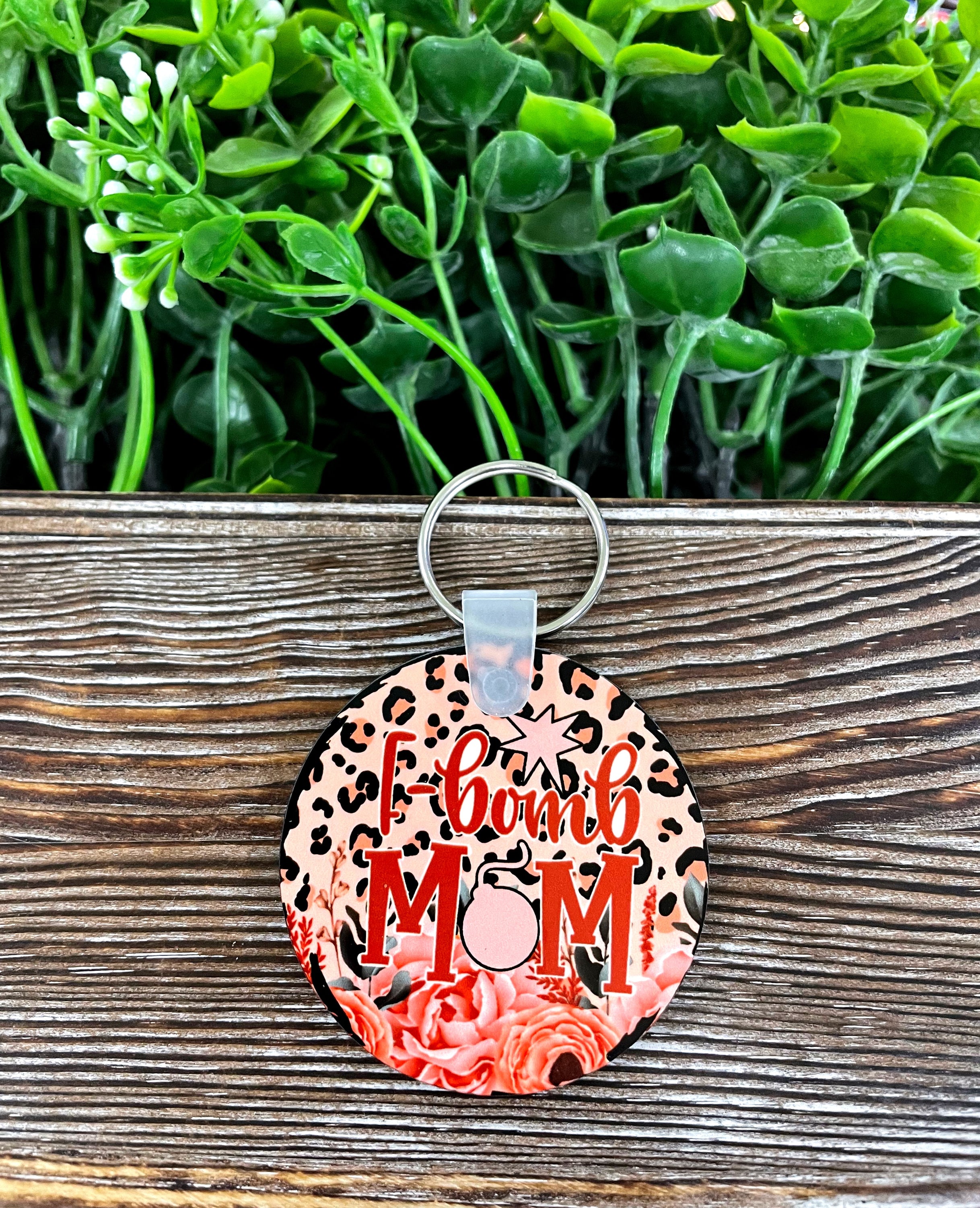 F-Bomb Mom MDF round keychain featuring a vibrant floral design, lightweight and stylish, perfect for boho enthusiasts.