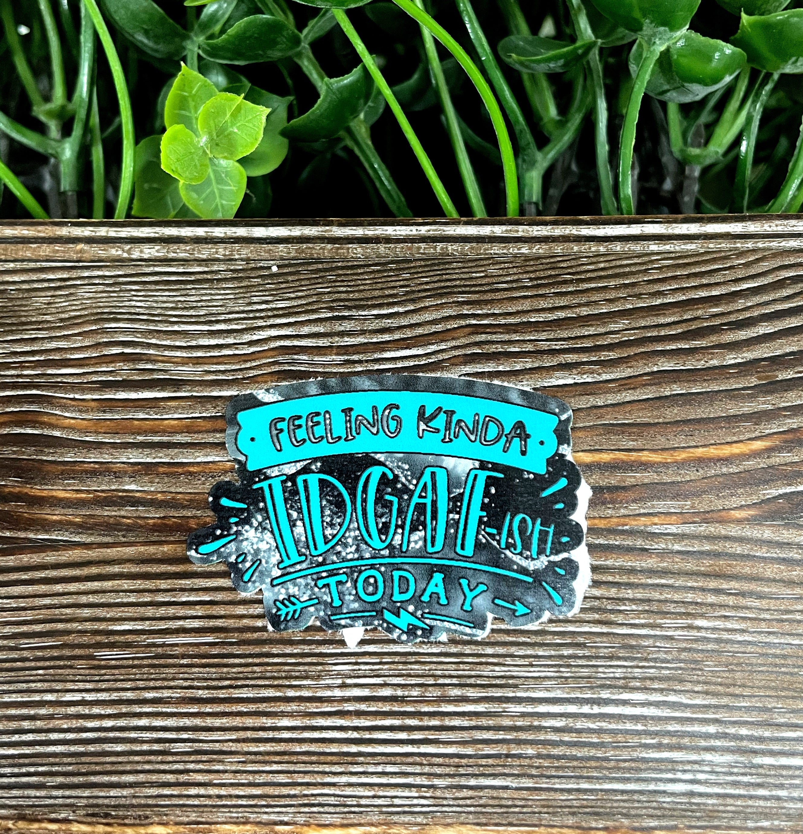 Die cut sticker featuring the phrase 'Feeling Kinda IDGAF ish Today' with a snarky design, perfect for personal expression.
