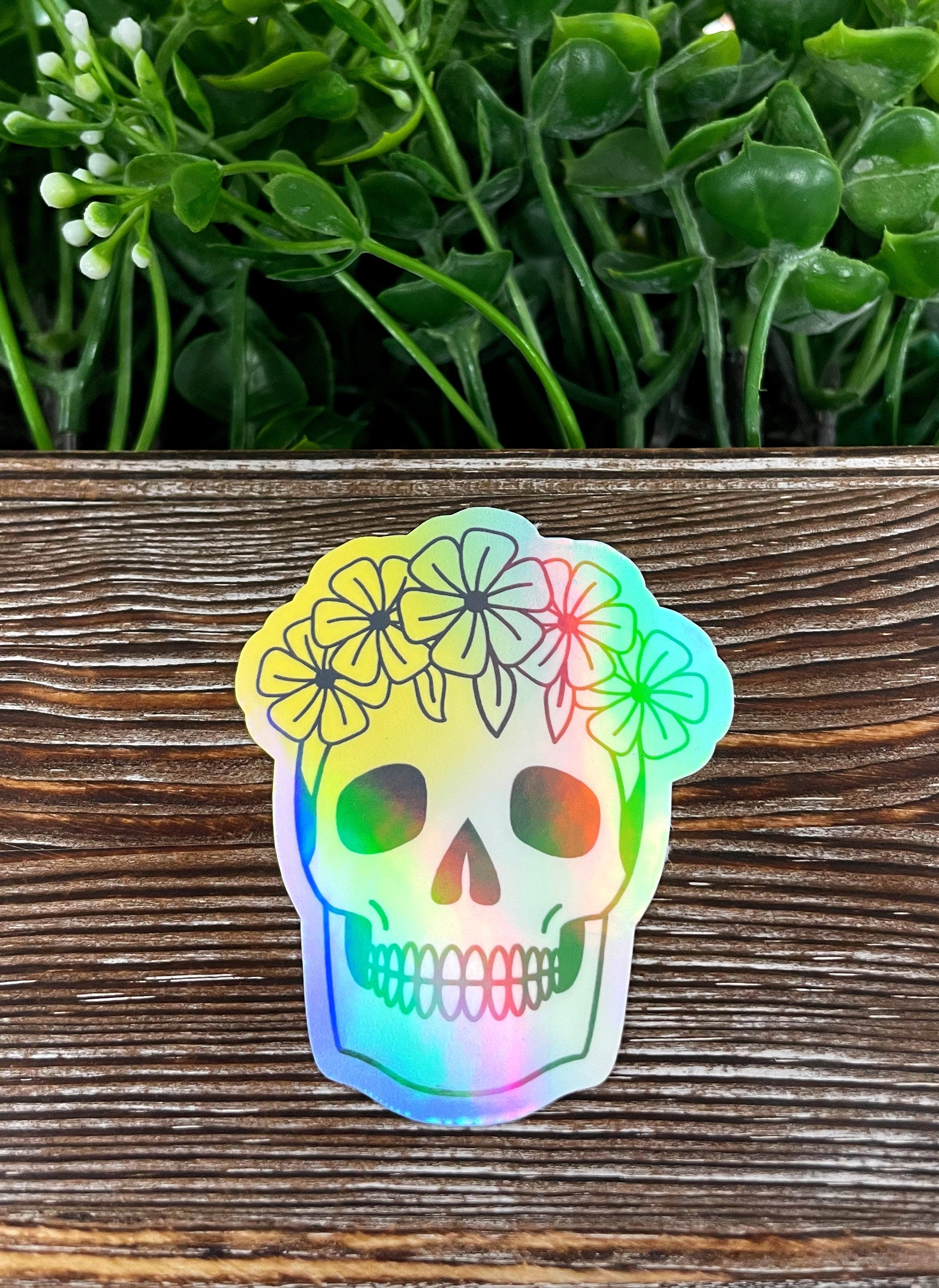 A vibrant Floral Skull die cut vinyl sticker featuring intricate floral designs, perfect for personalizing smooth surfaces.