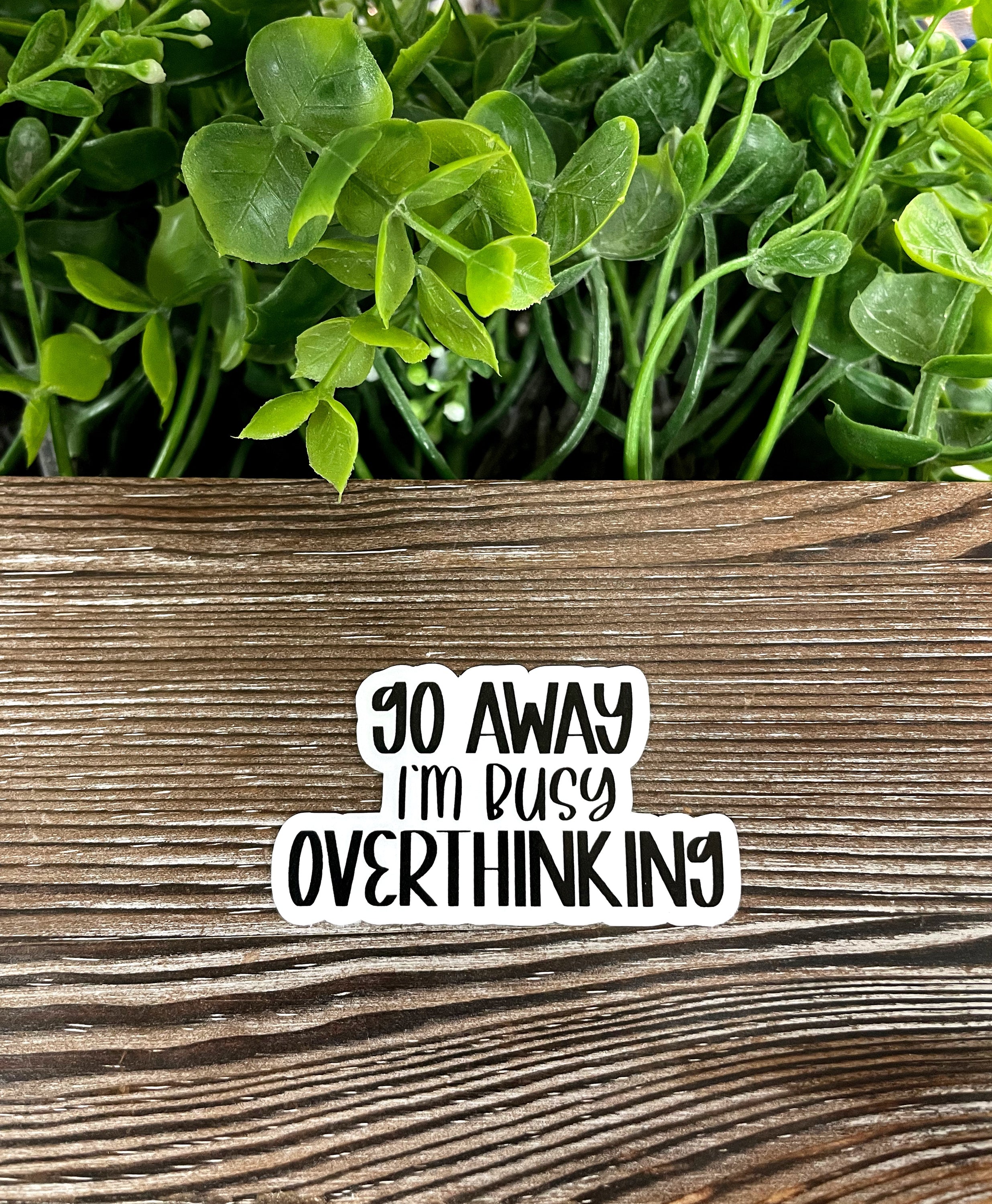 Go Away I'm Busy Overthinking die cut vinyl sticker featuring a boho design, perfect for personalizing smooth surfaces.