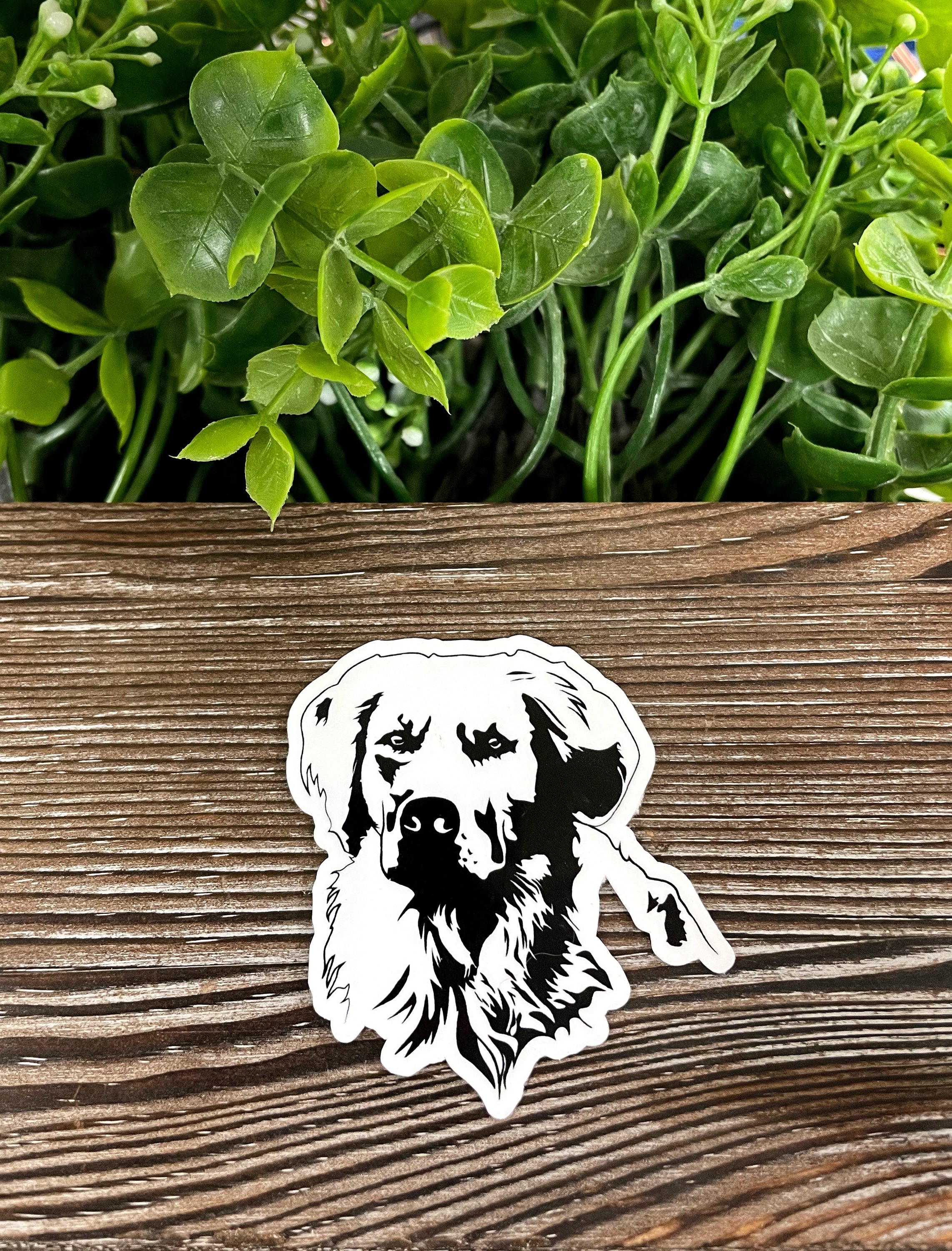 A vibrant Golden Retriever sticker featuring a playful design, perfect for decorating various smooth surfaces.