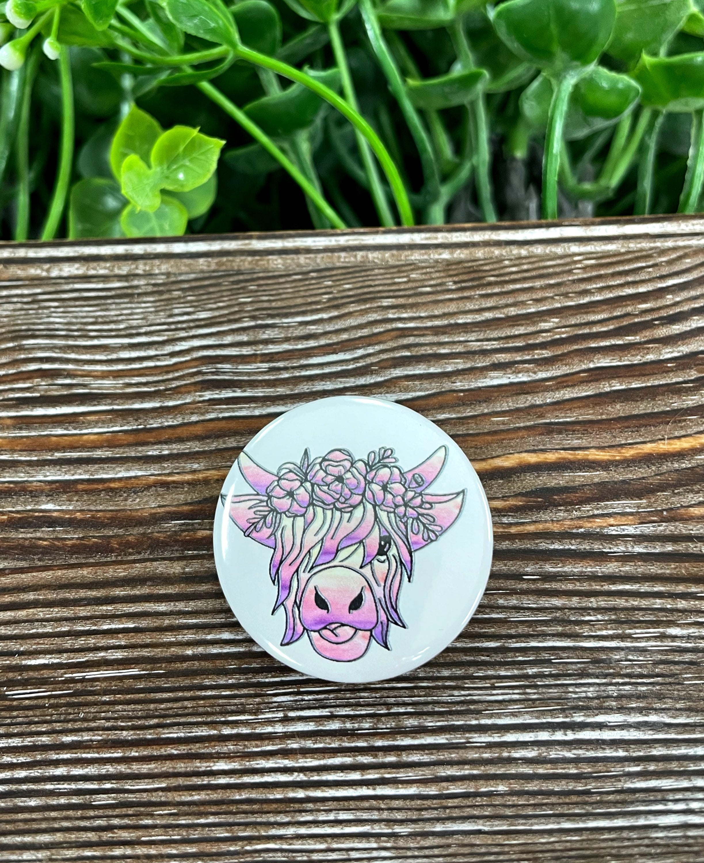 Highland Cow Graphic Art Button, 1.25 inches, featuring a colorful design on a plastic back.