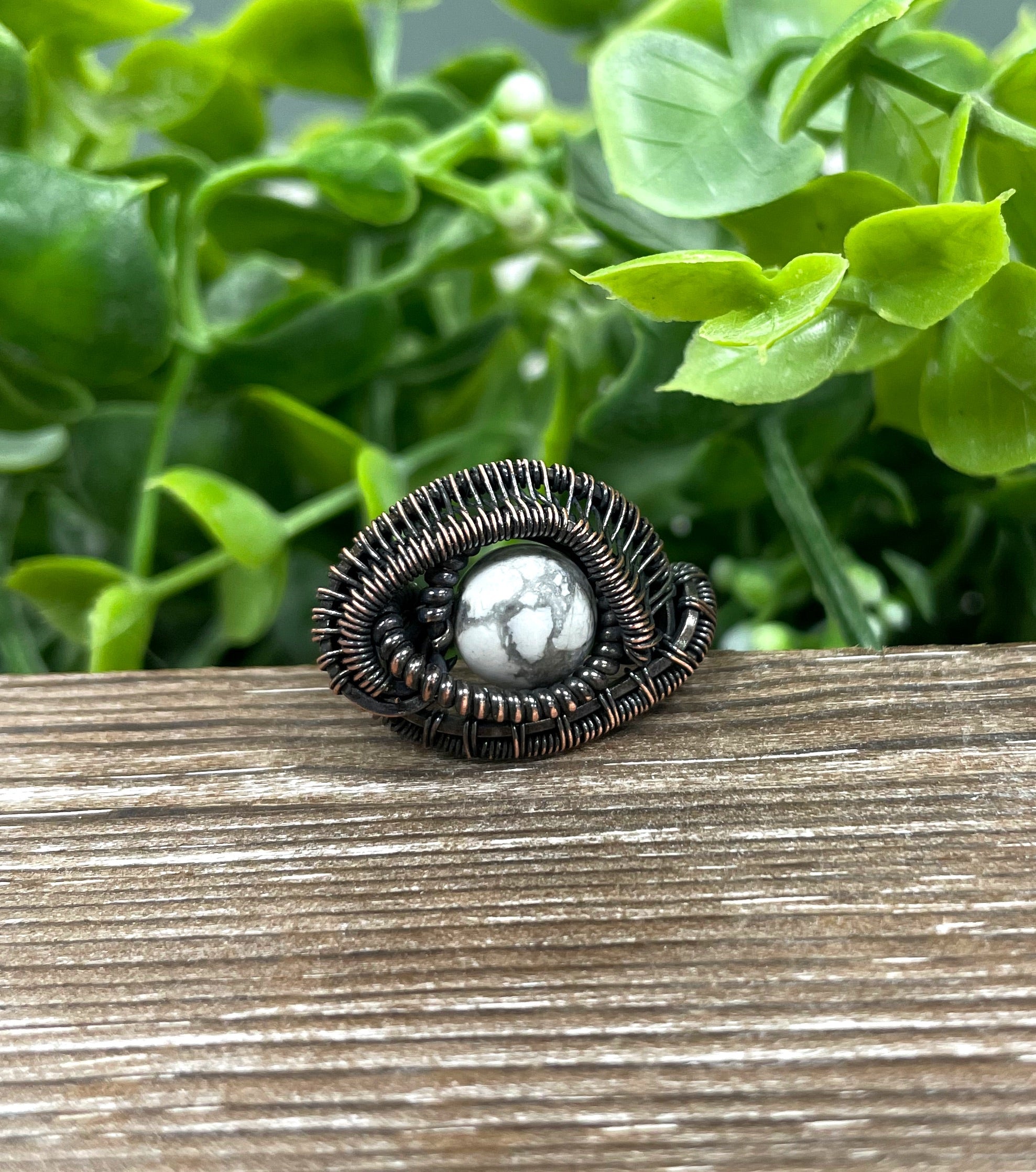 A beautifully crafted Howlite Wire Wrapped Ring featuring a Howlite bead elegantly wrapped in oxidized copper wire, showcasing an antique finish.