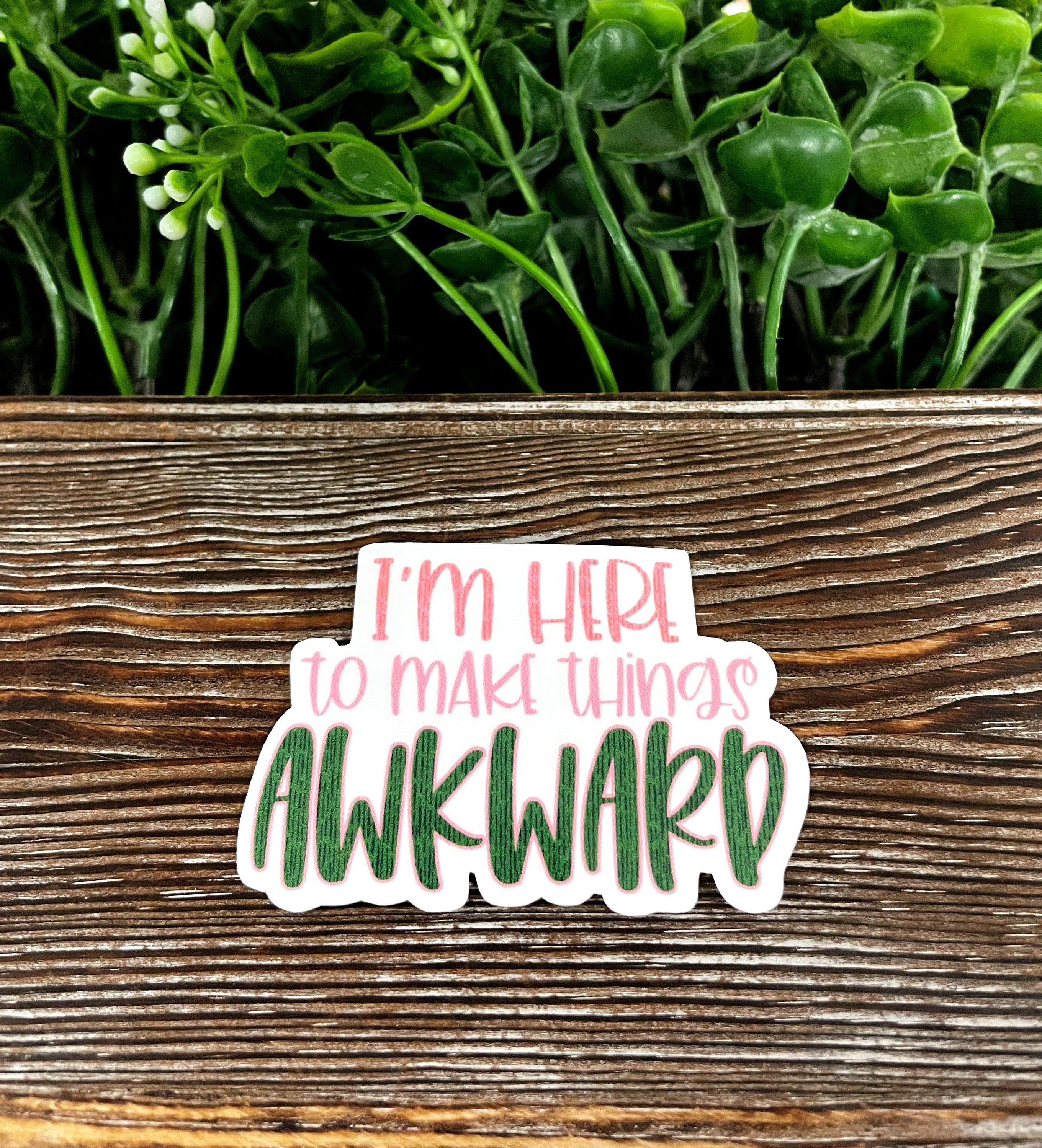 A colorful die cut vinyl sticker that reads 'I'm Here to Make Things Awkward', showcasing a boho fun design, perfect for personalizing various surfaces.