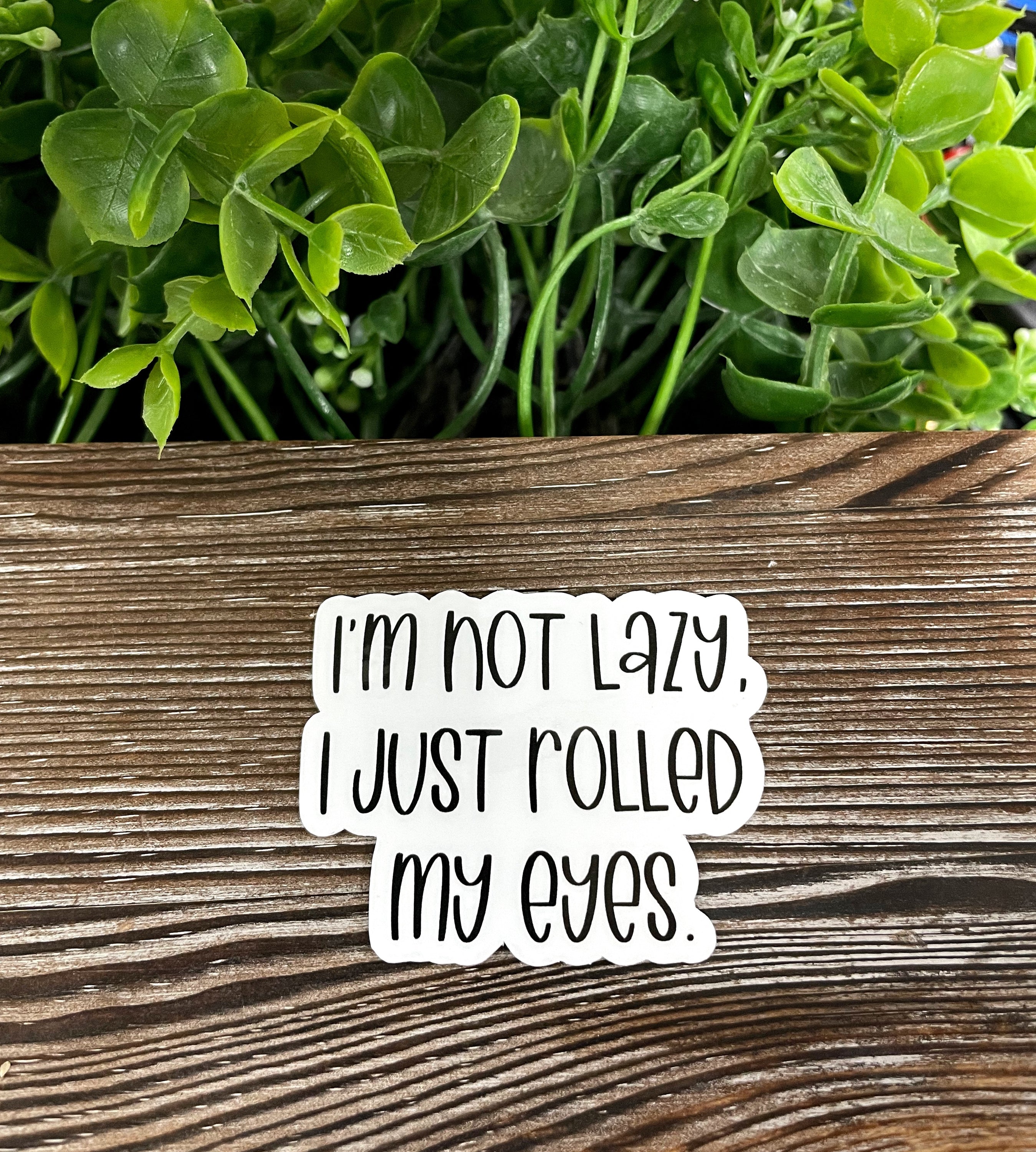 Die cut vinyl sticker featuring the phrase 'I'm Not Lazy I Just Rolled my Eyes' with a boho design, perfect for personalizing items.
