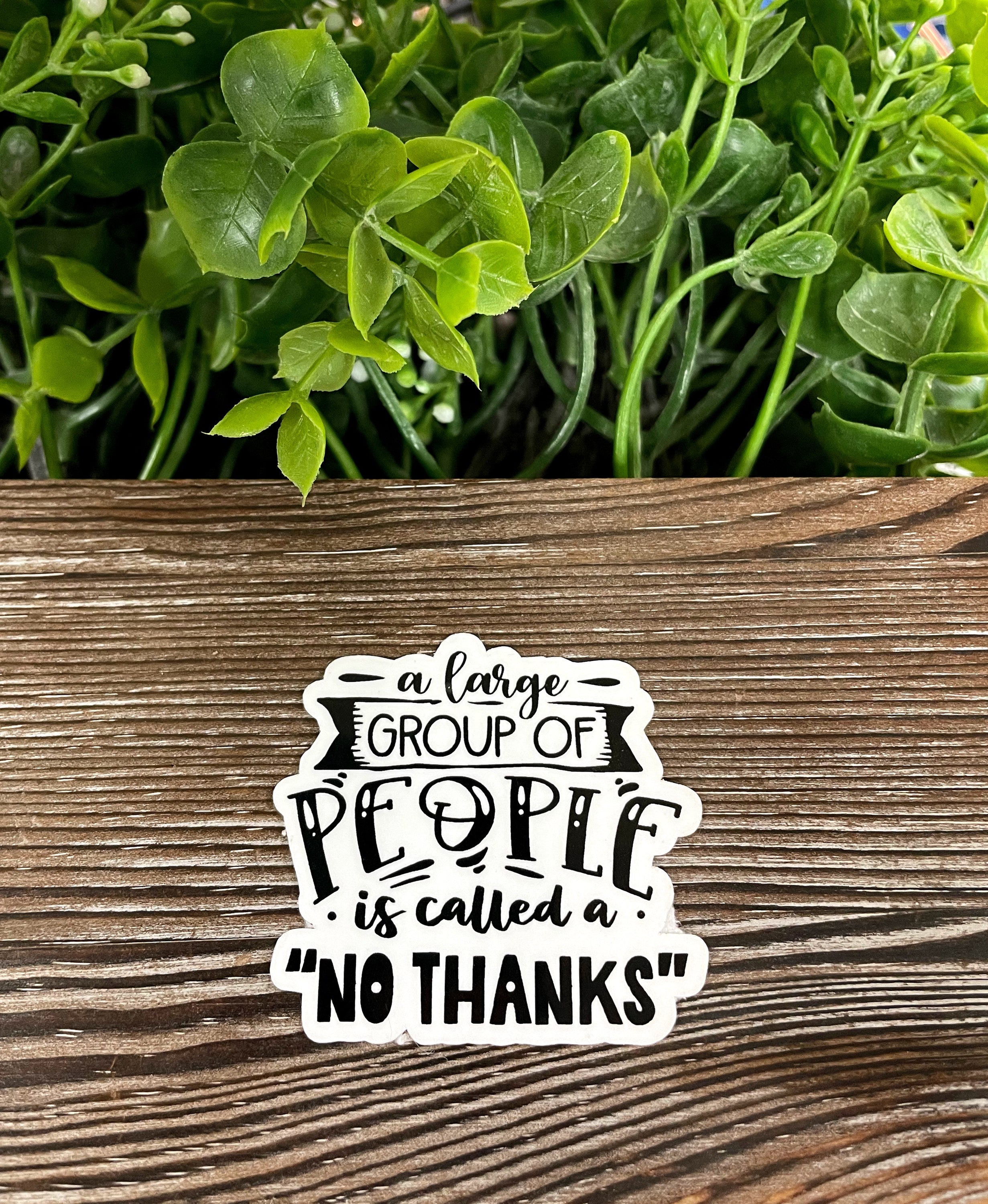 Colorful Introvert Die Cut Vinyl Sticker on a smooth surface, showcasing boho design and water-resistant features.