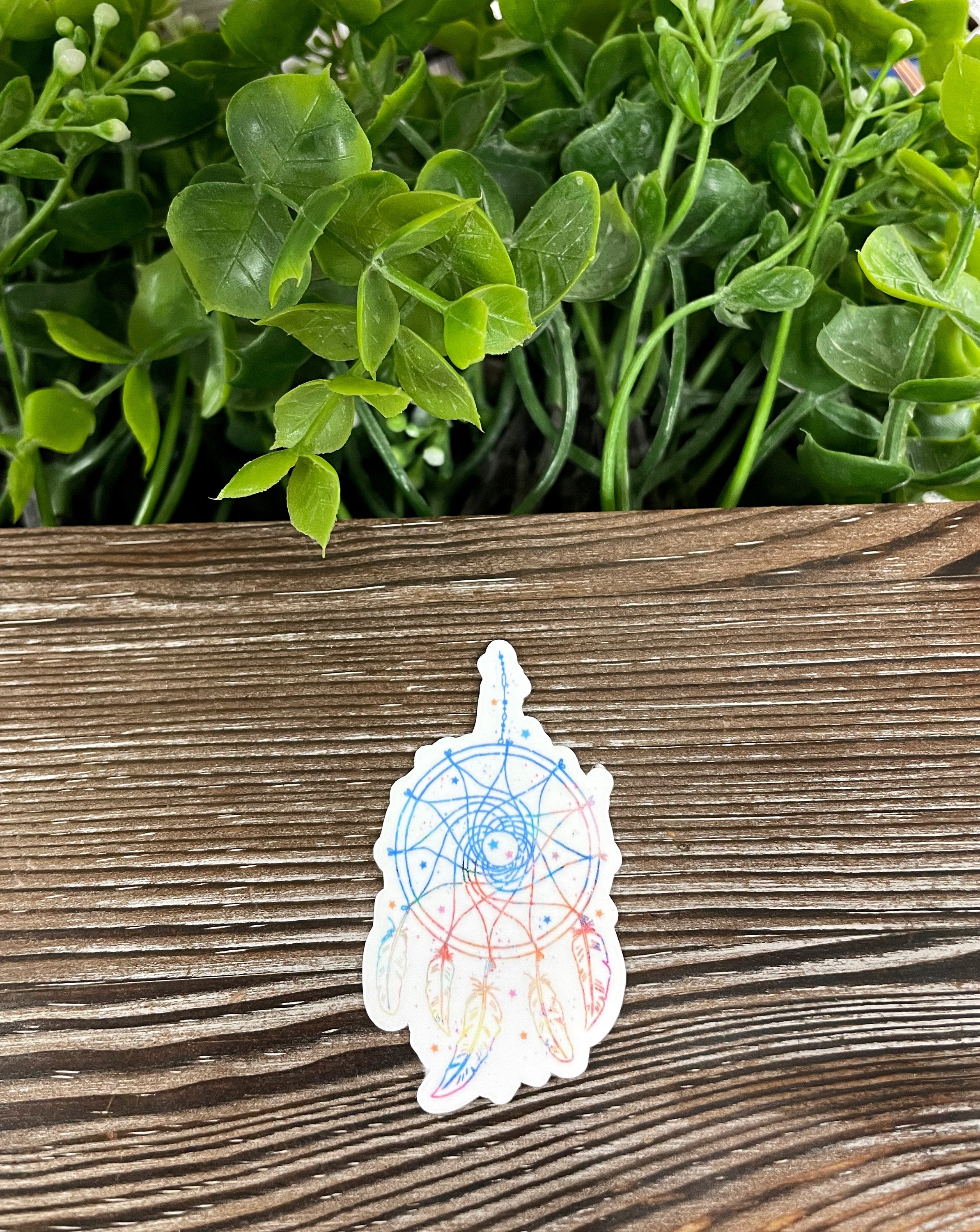 Light Colors Dreamcatcher die cut vinyl sticker featuring feathers, vibrant colors, and a boho design, perfect for personalizing items.