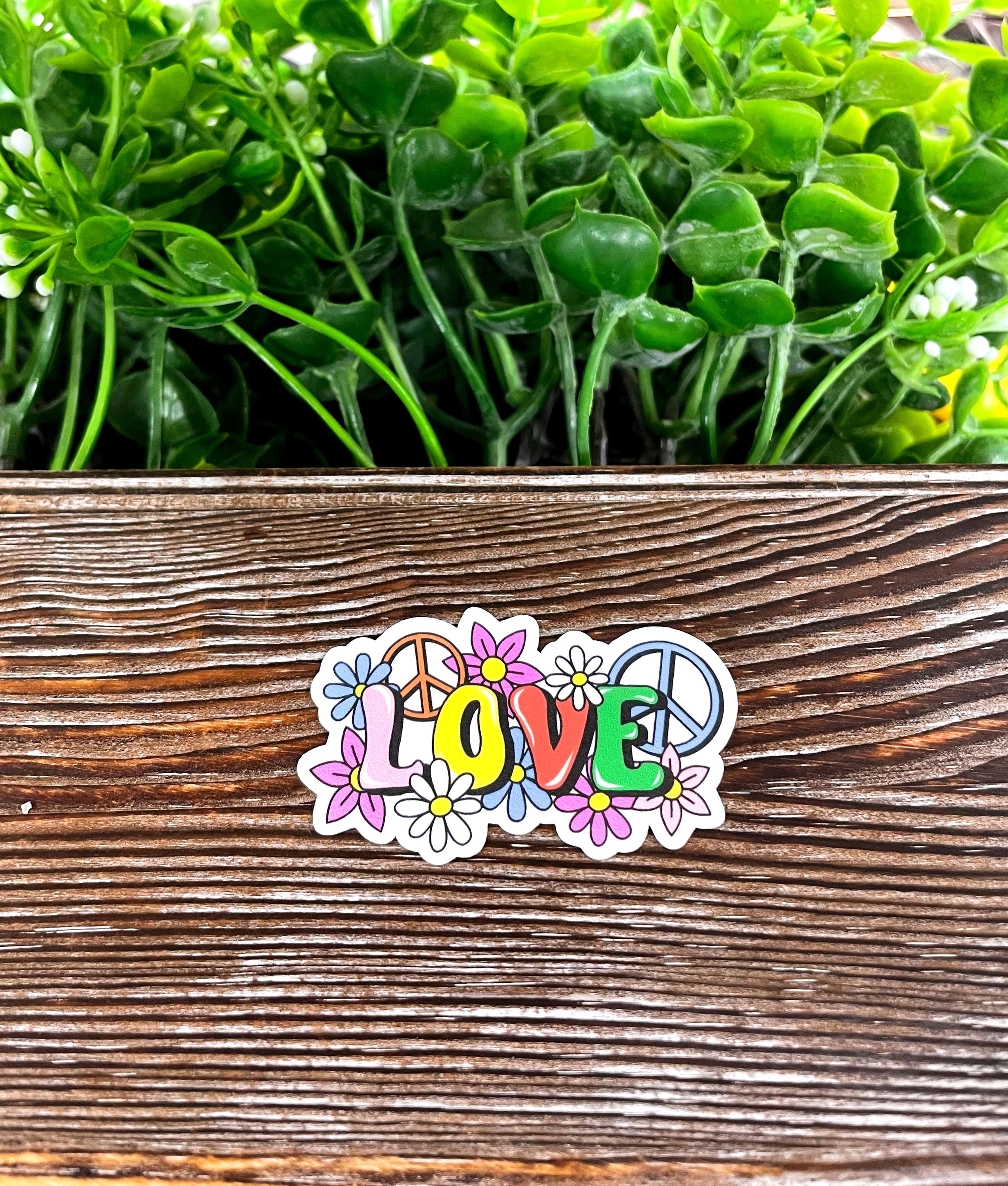 Colorful Love Sticker featuring peace signs, die cut vinyl design, perfect for boho style decoration.