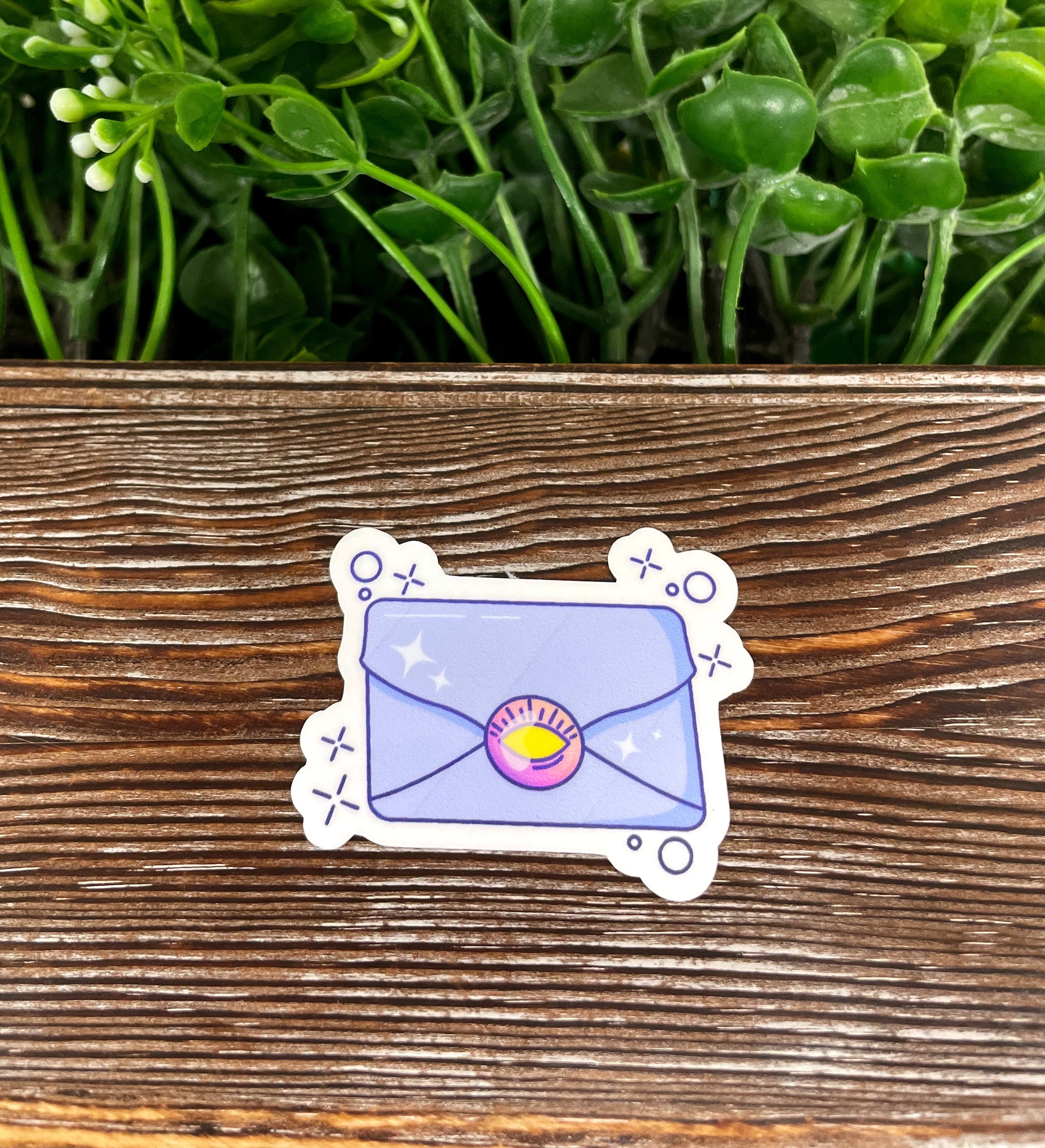 Magical Purple Letter Sticker displayed on a smooth surface, showcasing its vibrant color and design.