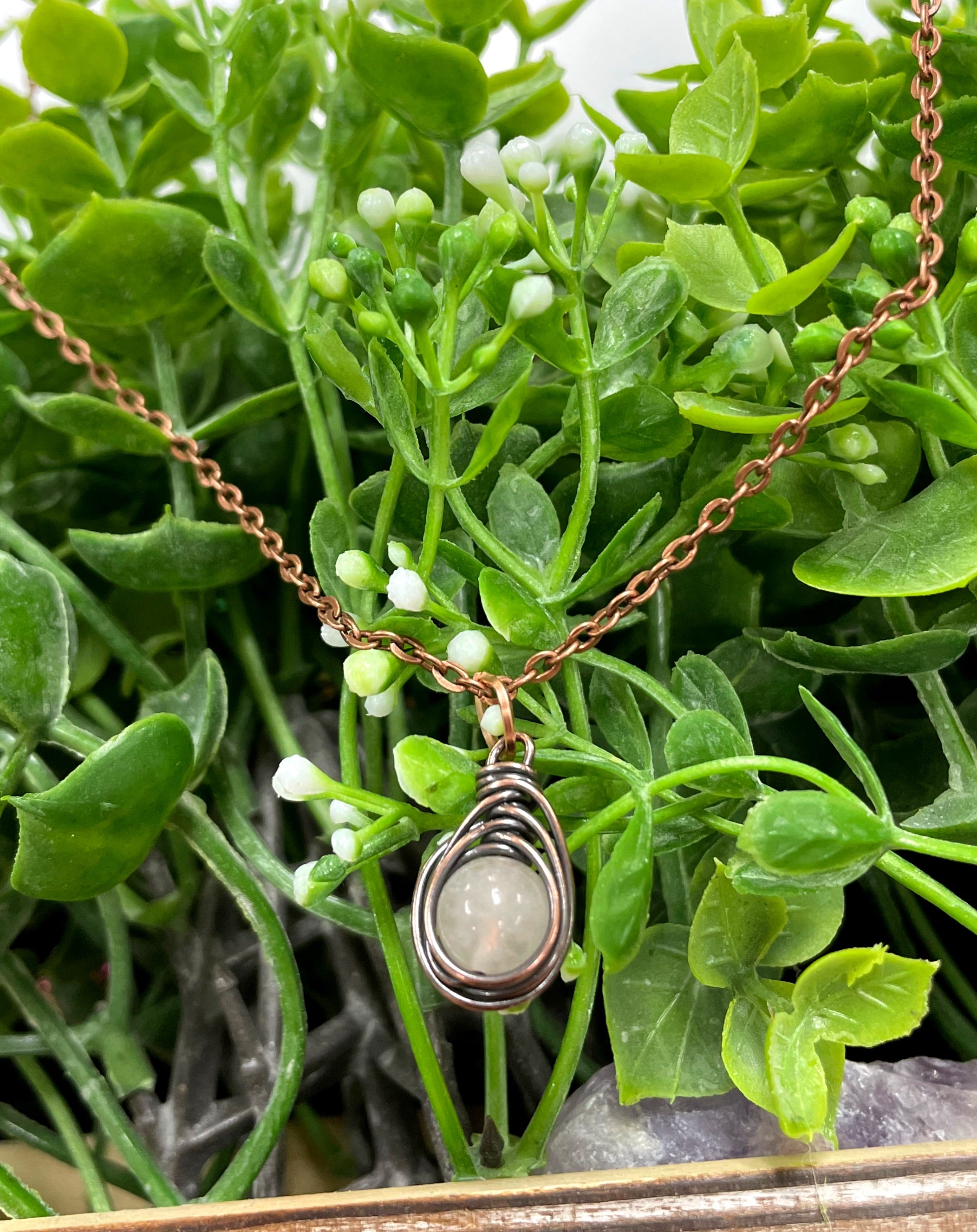 Mini Wire Wrapped Rose Quartz Gemstone Pendant with oxidized copper wire on a 21-inch cord, featuring a unique mushroom shape.