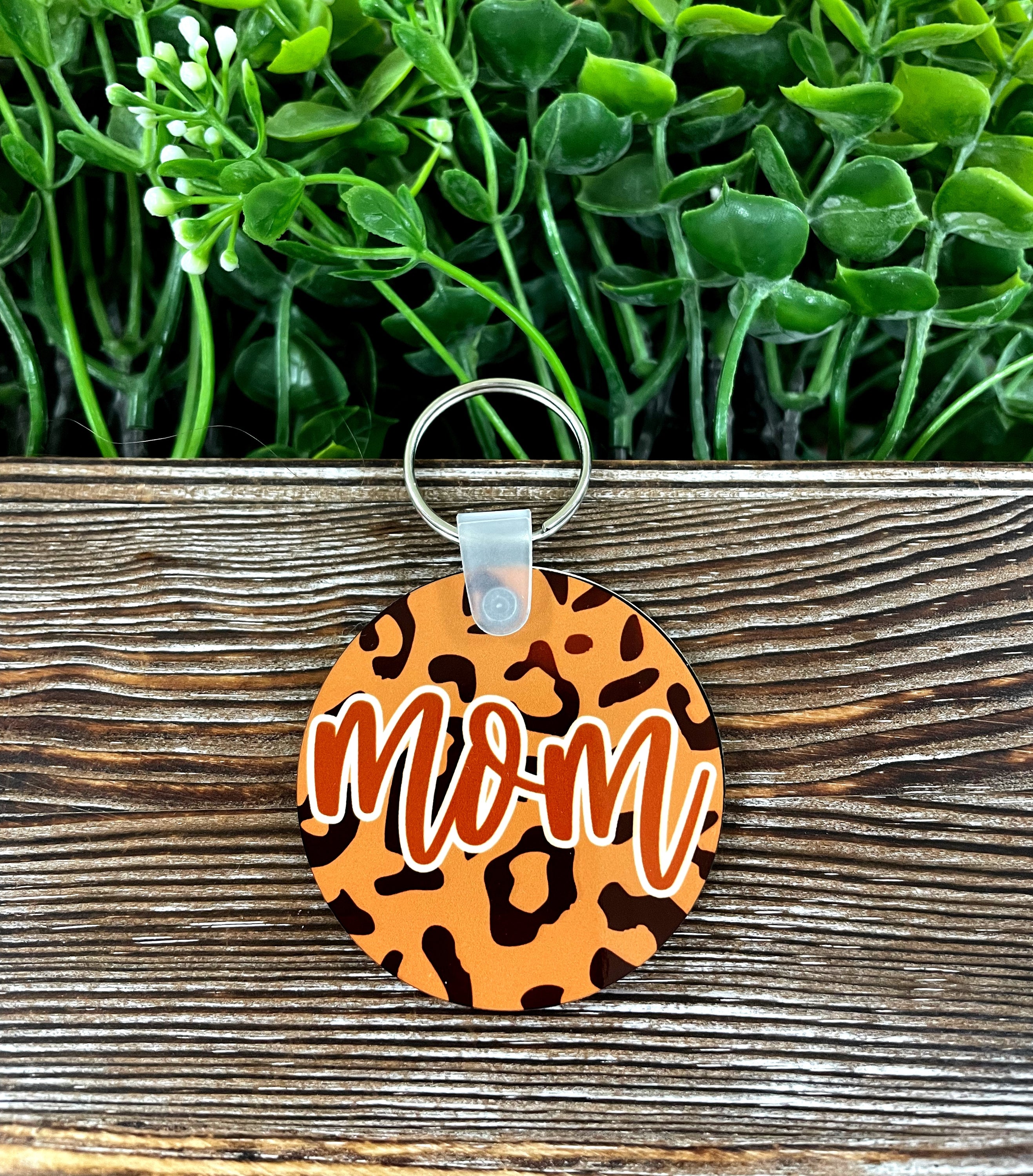 Mom MDF Round Keychain featuring a vibrant cheetah print design, lightweight and stylish, perfect for personal use or gifting.