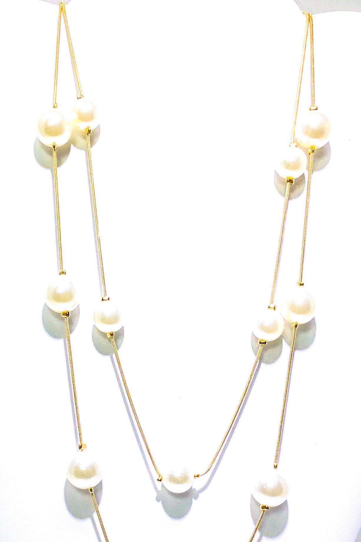 Faith & Pearls Necklace featuring a double strand of simulated pearls in a gold finish, perfect for special occasions.