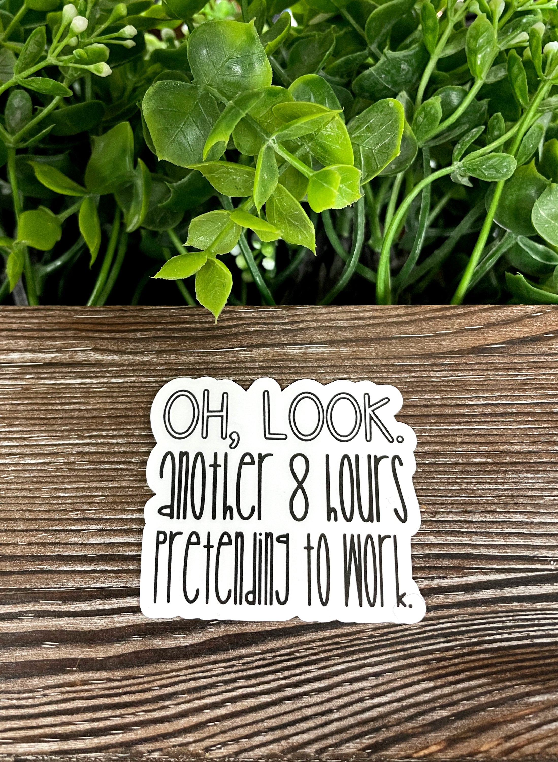 Die cut vinyl sticker with the phrase 'Oh Look Another 8 Hours Pretending to Work', featuring a humorous design suitable for various surfaces.