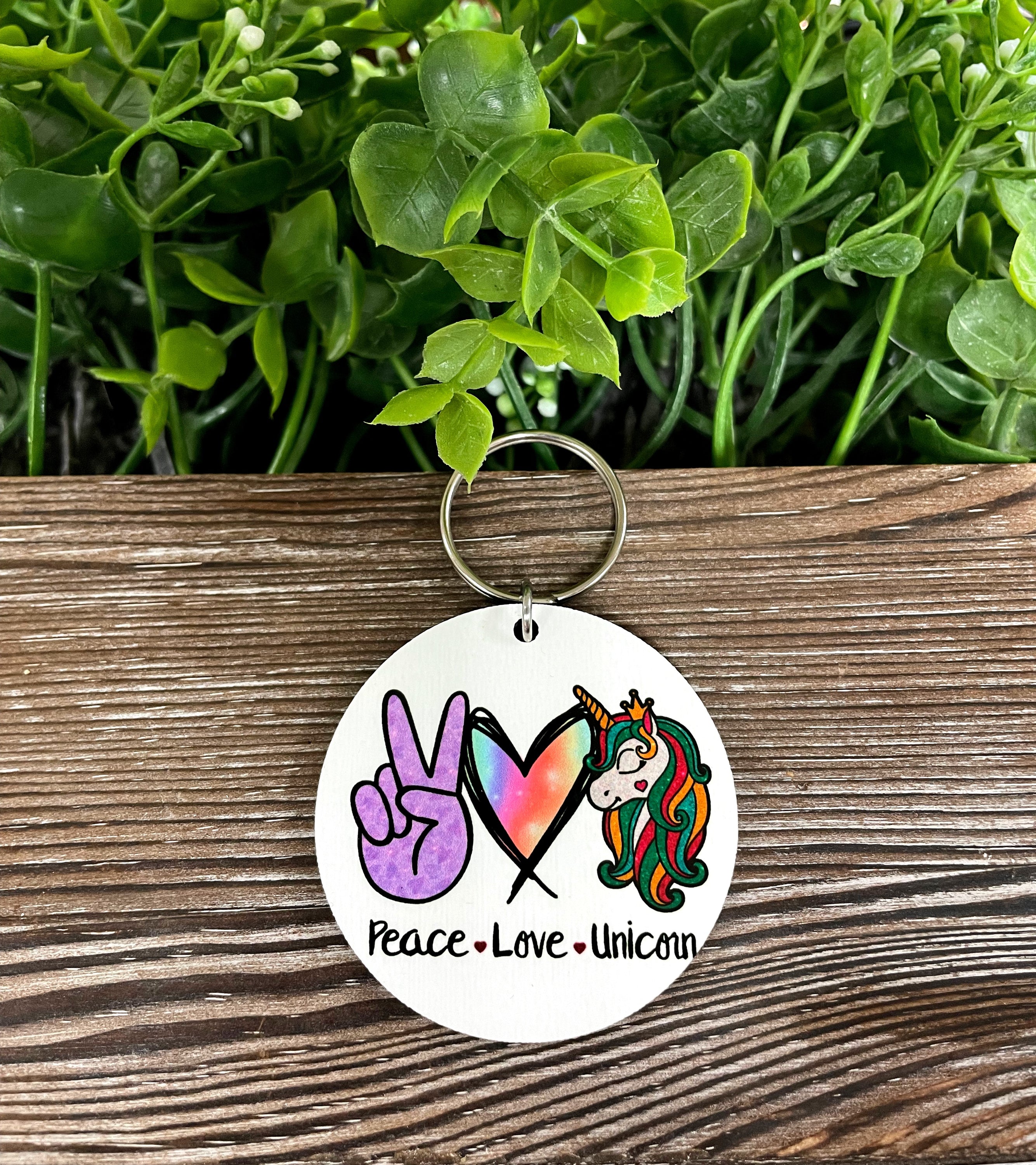 A colorful MDF round keychain featuring a whimsical unicorn design, perfect for boho enthusiasts.
