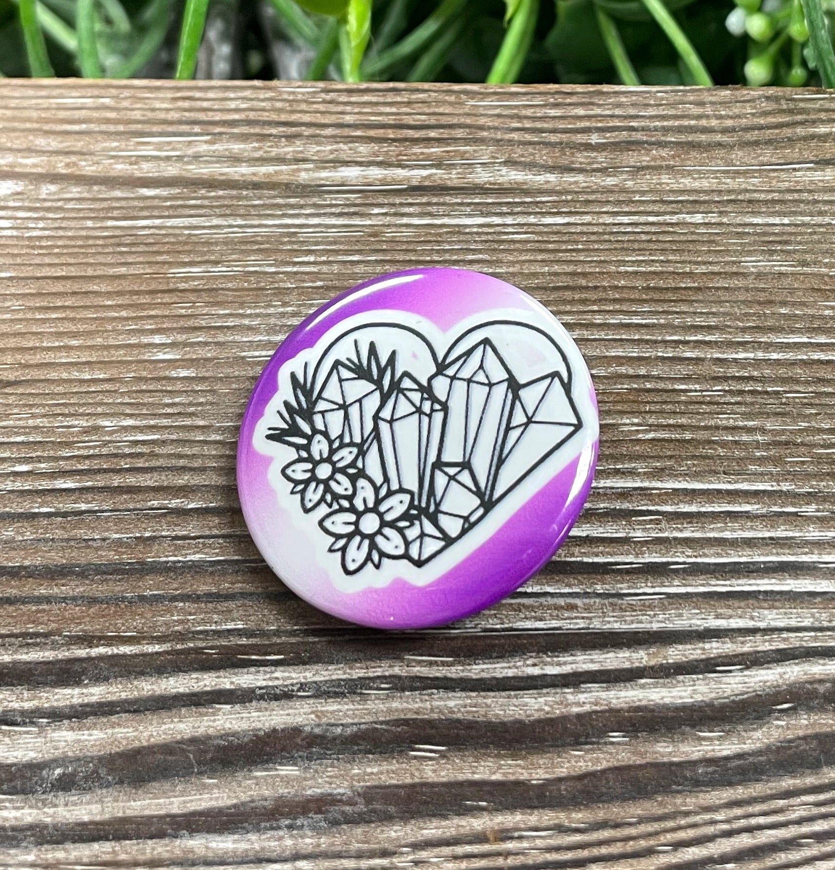 Purple heart button pin adorned with sparkling crystals, measuring 1.25 inches, perfect for personalizing bags and masks.
