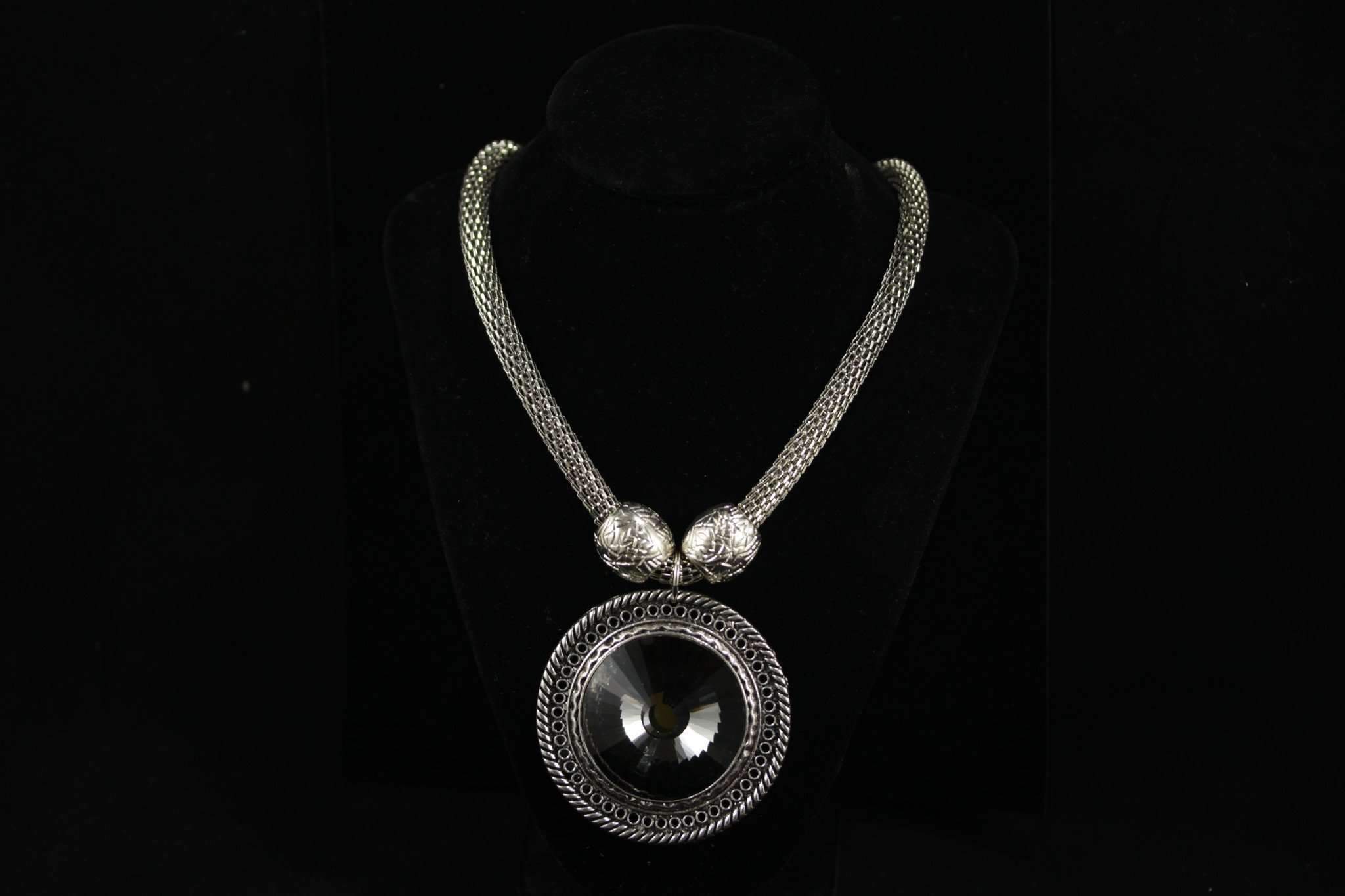 Queens Medallion Necklace featuring a brilliant medallion on an antique silver tone rope chain with engraved charms.