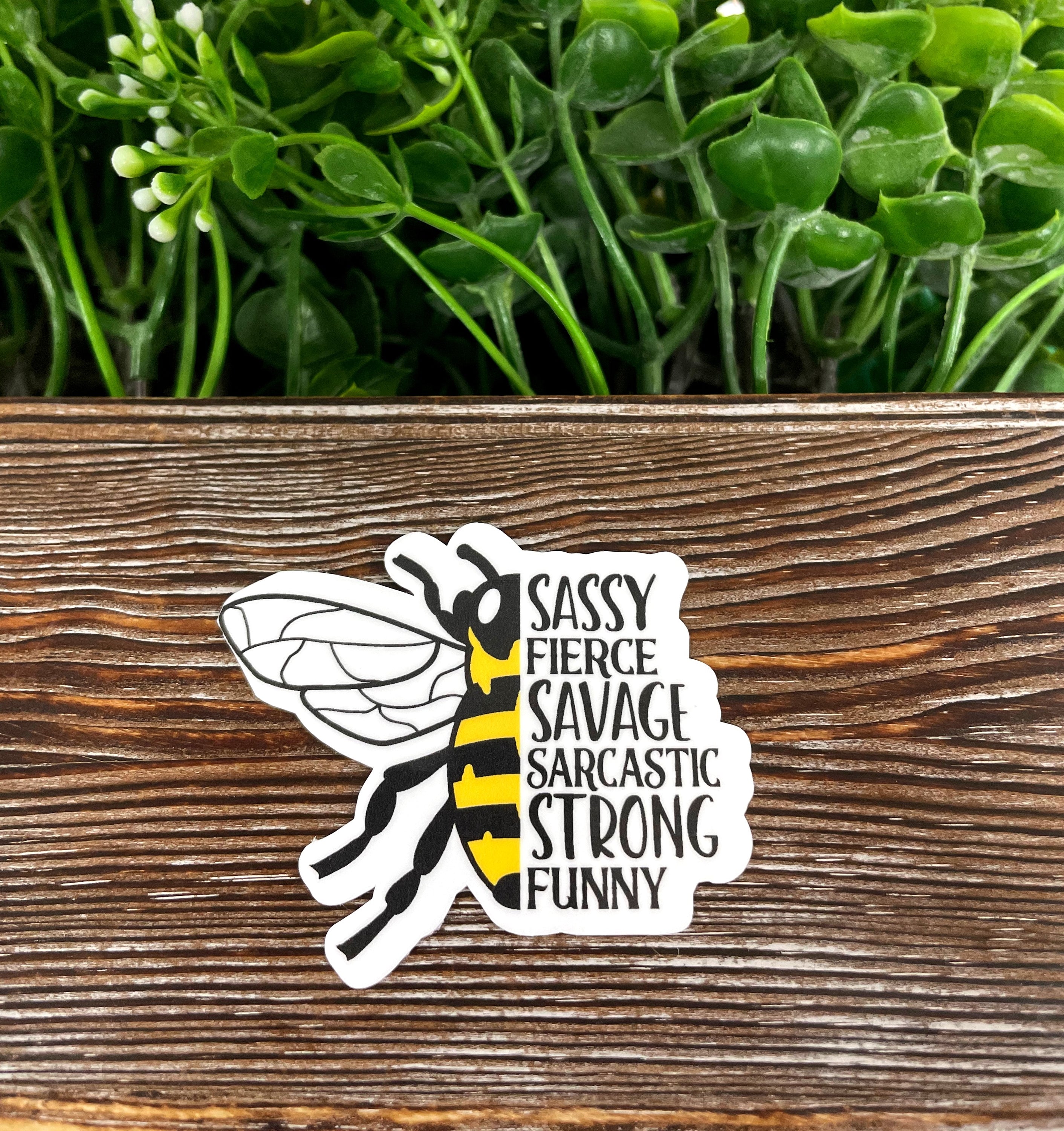 Sassy Fierce Savage Sarcastic Strong Funny die cut vinyl sticker on a smooth surface, showcasing vibrant colors and a humorous design.