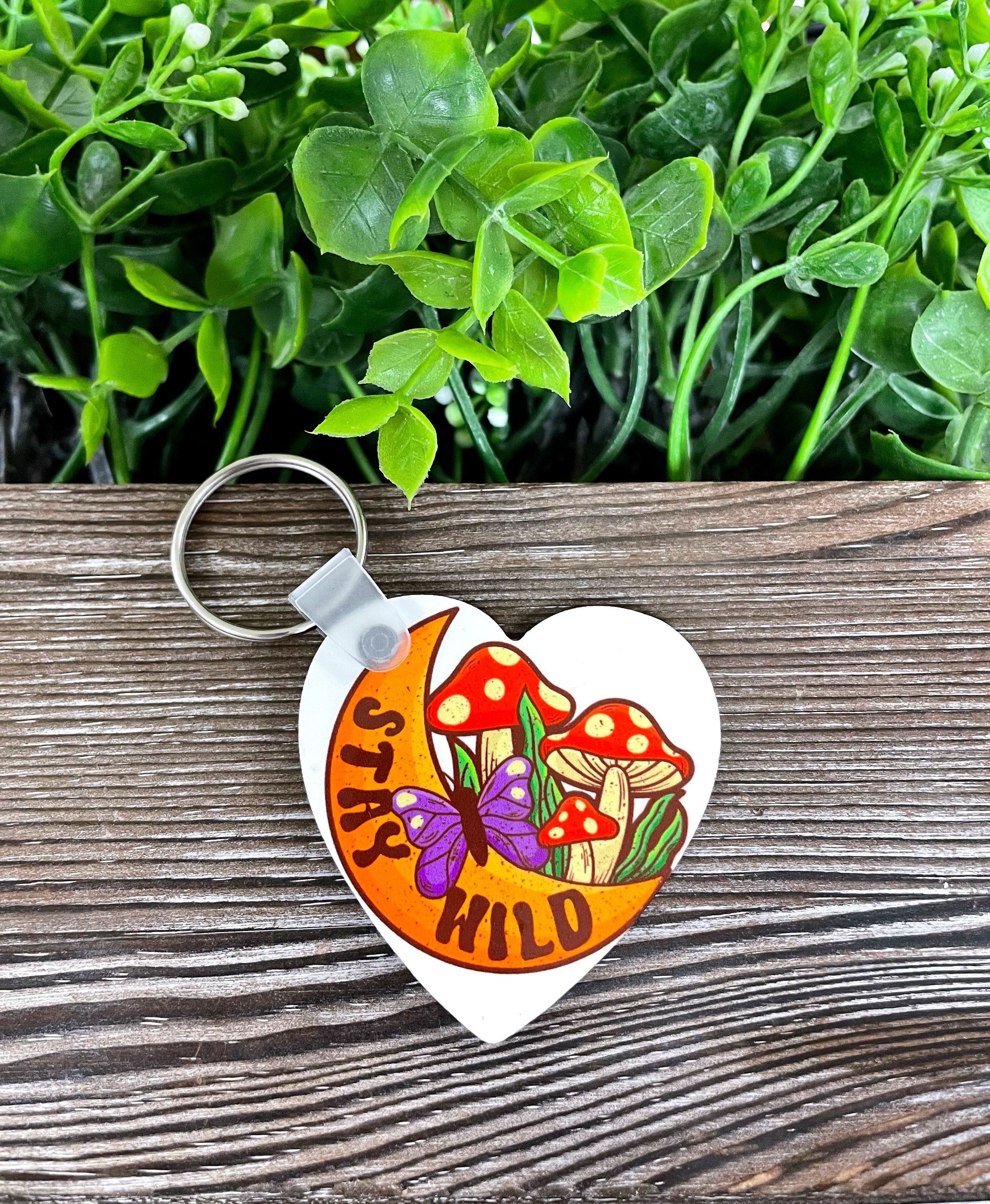 Stay Wild Crescent Moon MDF Heart Keychain featuring a colorful boho mushroom design, lightweight and perfect for personal expression.