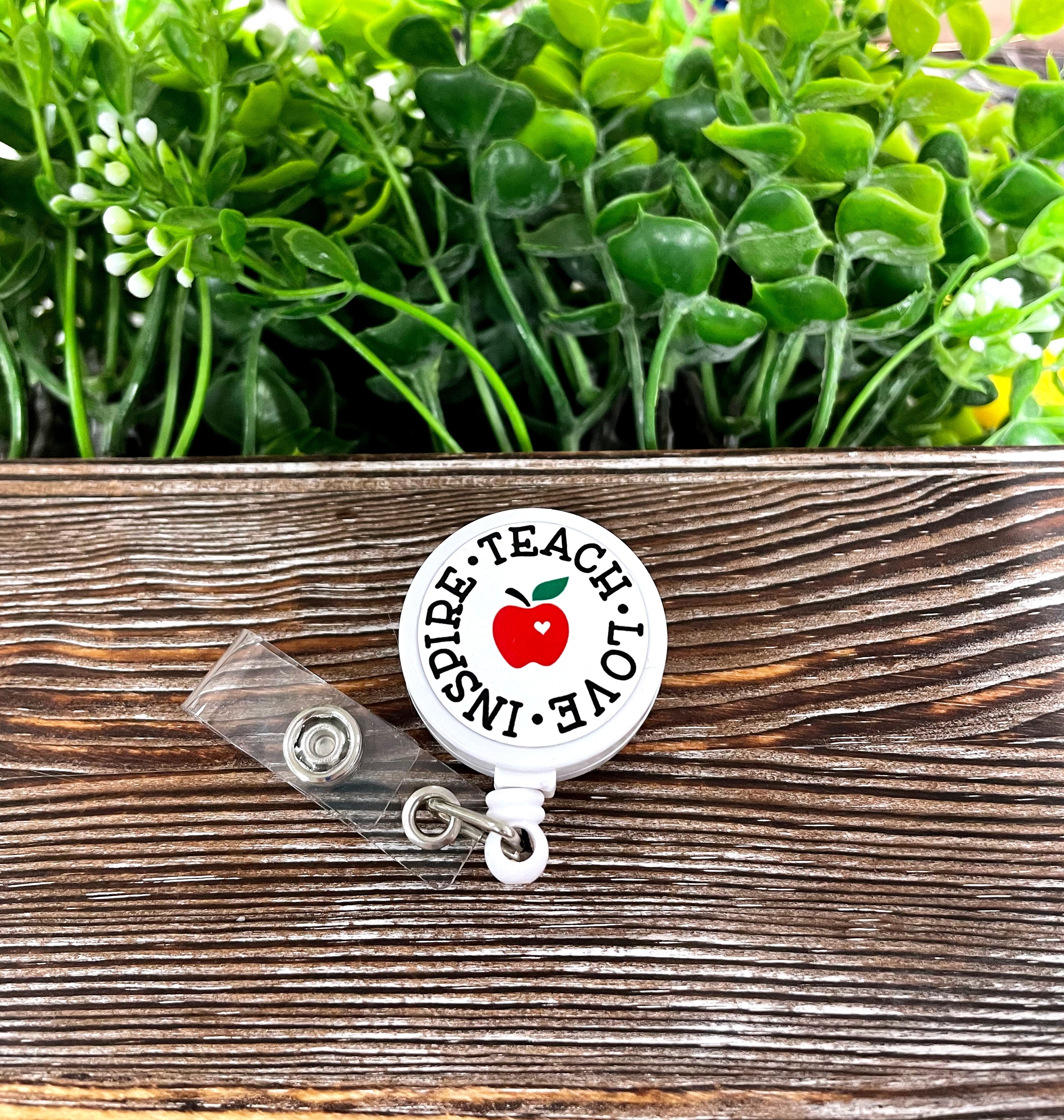 Teach Love Inspire retractable badge reel featuring a boho design, measuring 1.2 inches in diameter with a 24-inch retractable cord.