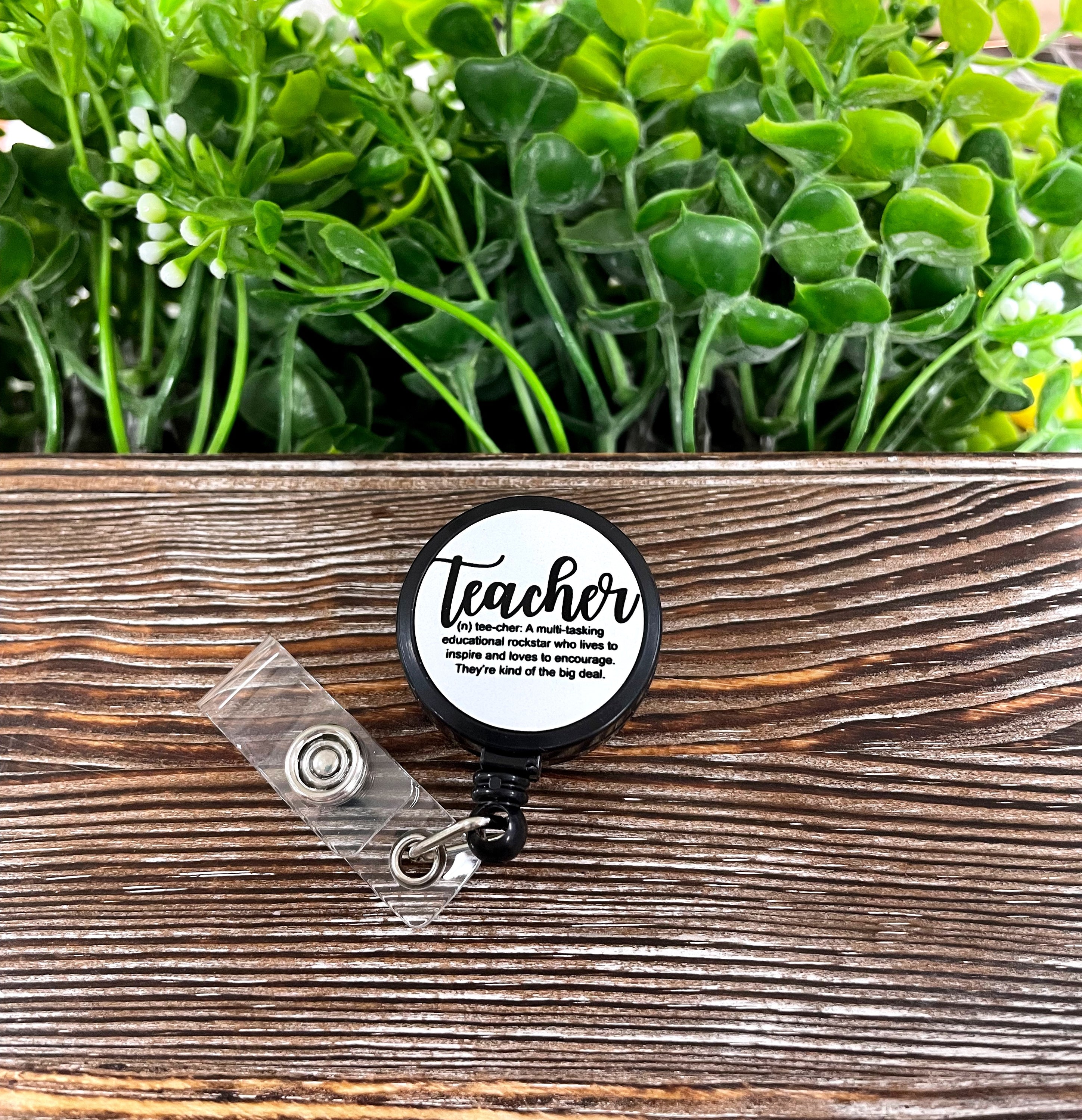 Colorful Teacher Definition Retractable Badge Reel with a 24-inch cord, featuring a unique design on a metal blank.