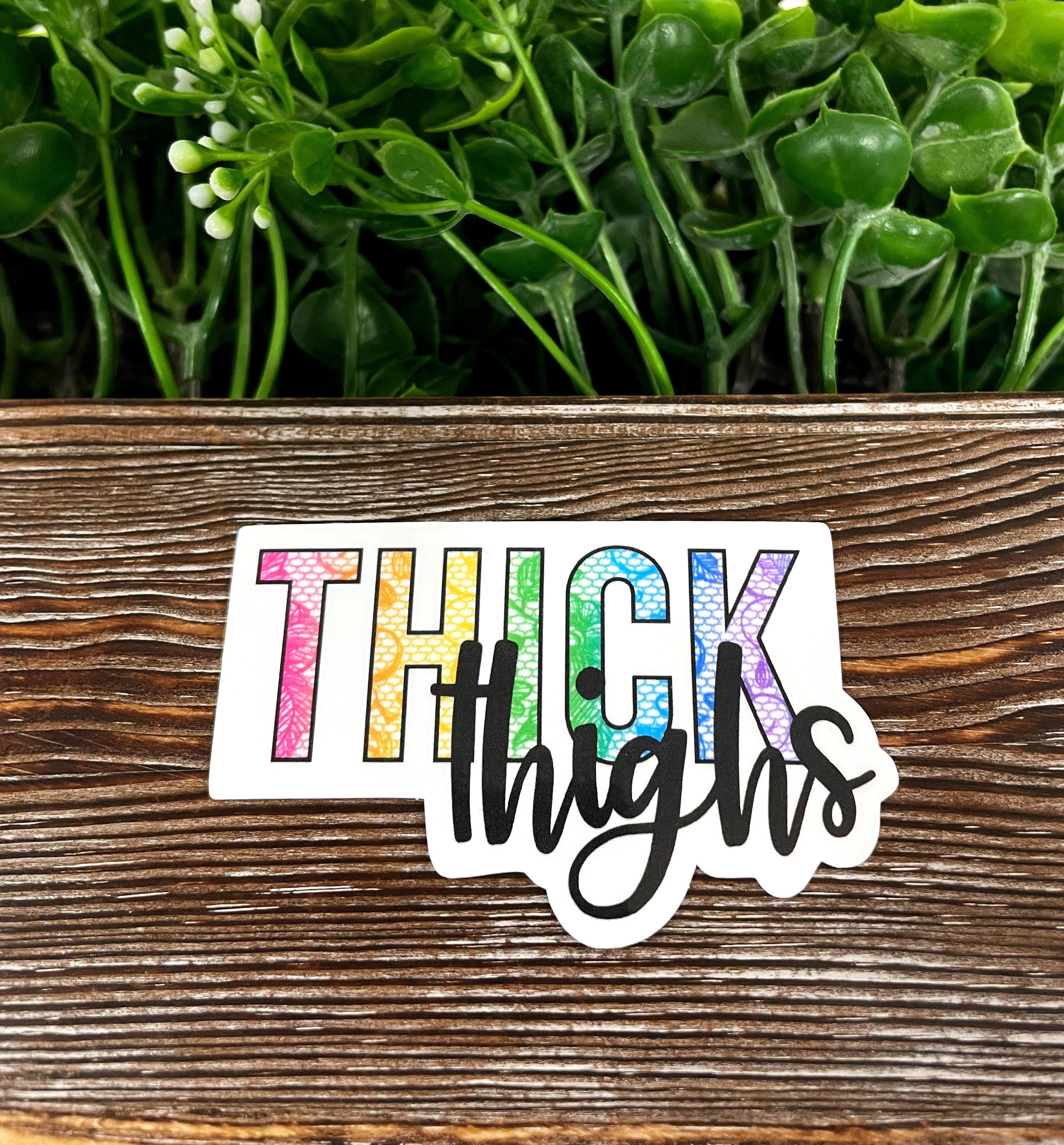 Thick Thighs Die Cut Vinyl Sticker featuring a fun boho design, perfect for personalizing water bottles and notebooks.