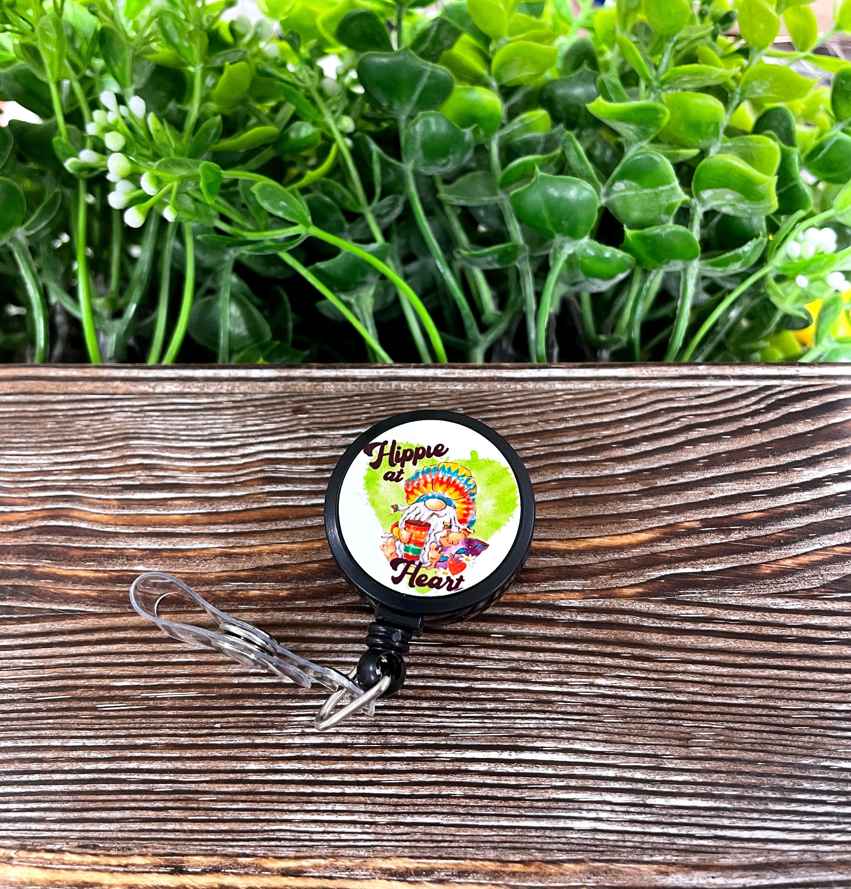 A vibrant tie-dye retractable badge reel featuring a bohemian design, measuring 1.2 inches in diameter with a 24-inch extension cord.