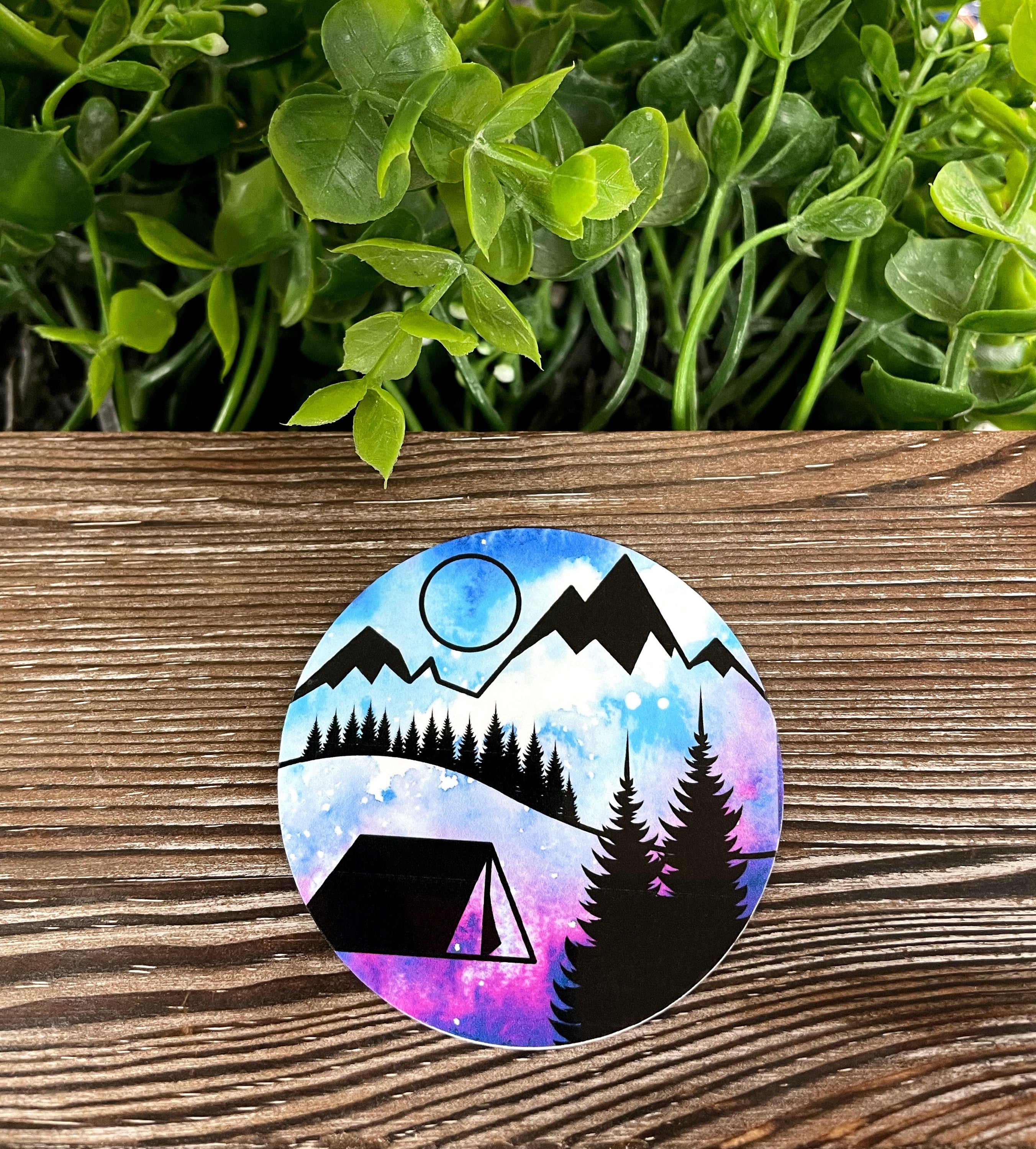 A vibrant Trees Mountains and Moon sticker featuring a scenic landscape with trees, mountains, and a moon, perfect for personalizing items.