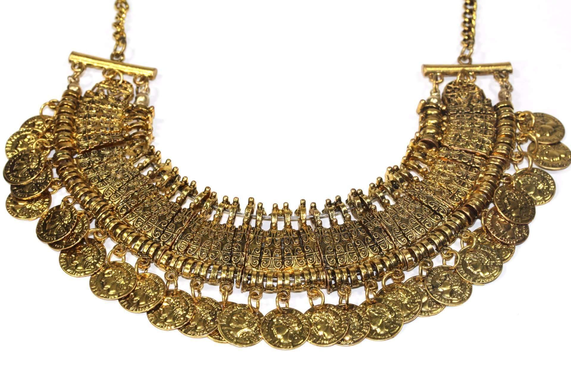 Tribal Style Coin Statement Necklace featuring a gold tone with scroll work pendant and dangling antique coins.