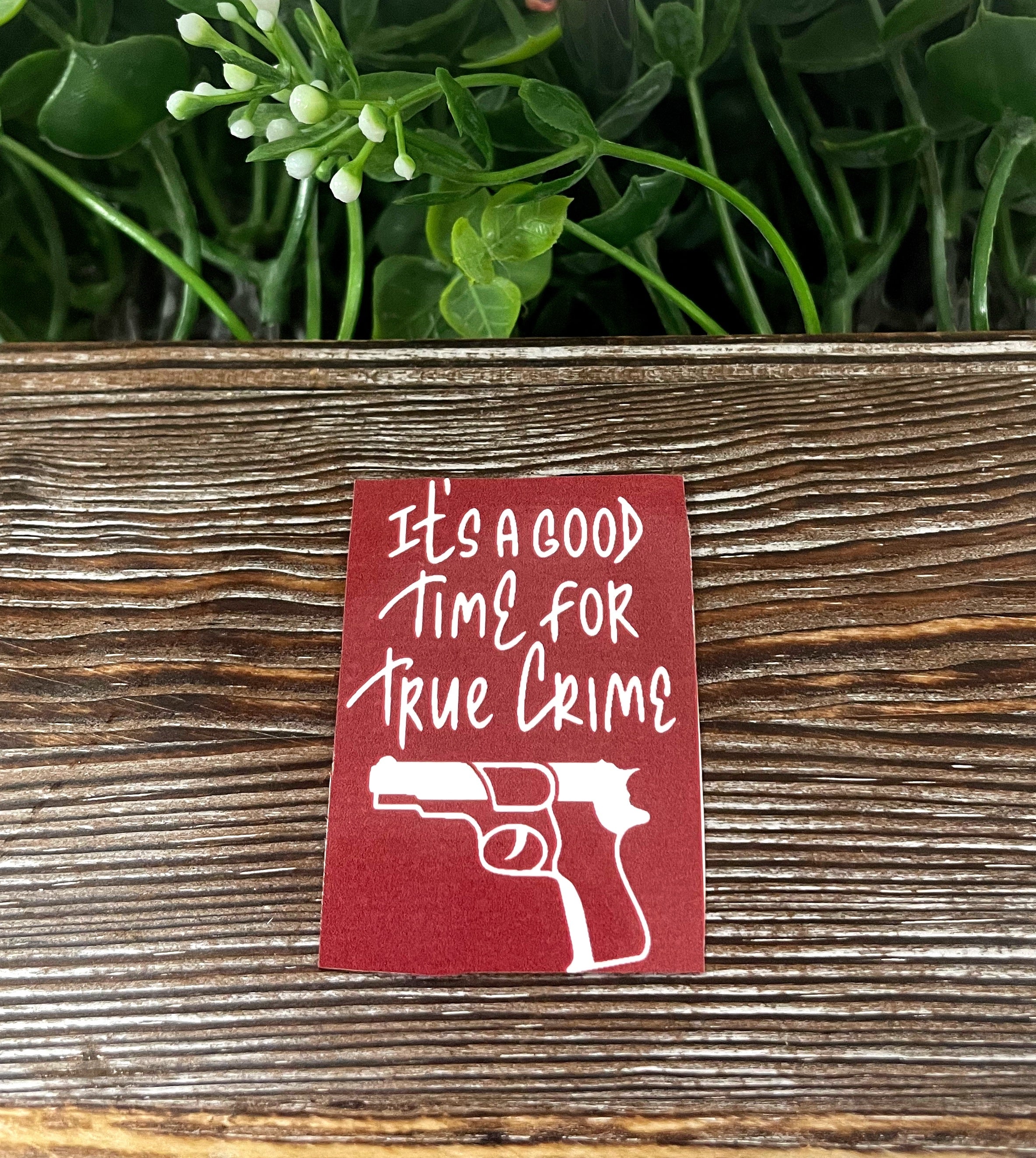 A vibrant die cut sticker featuring true crime graphic art, showcasing a unique design perfect for personal expression.