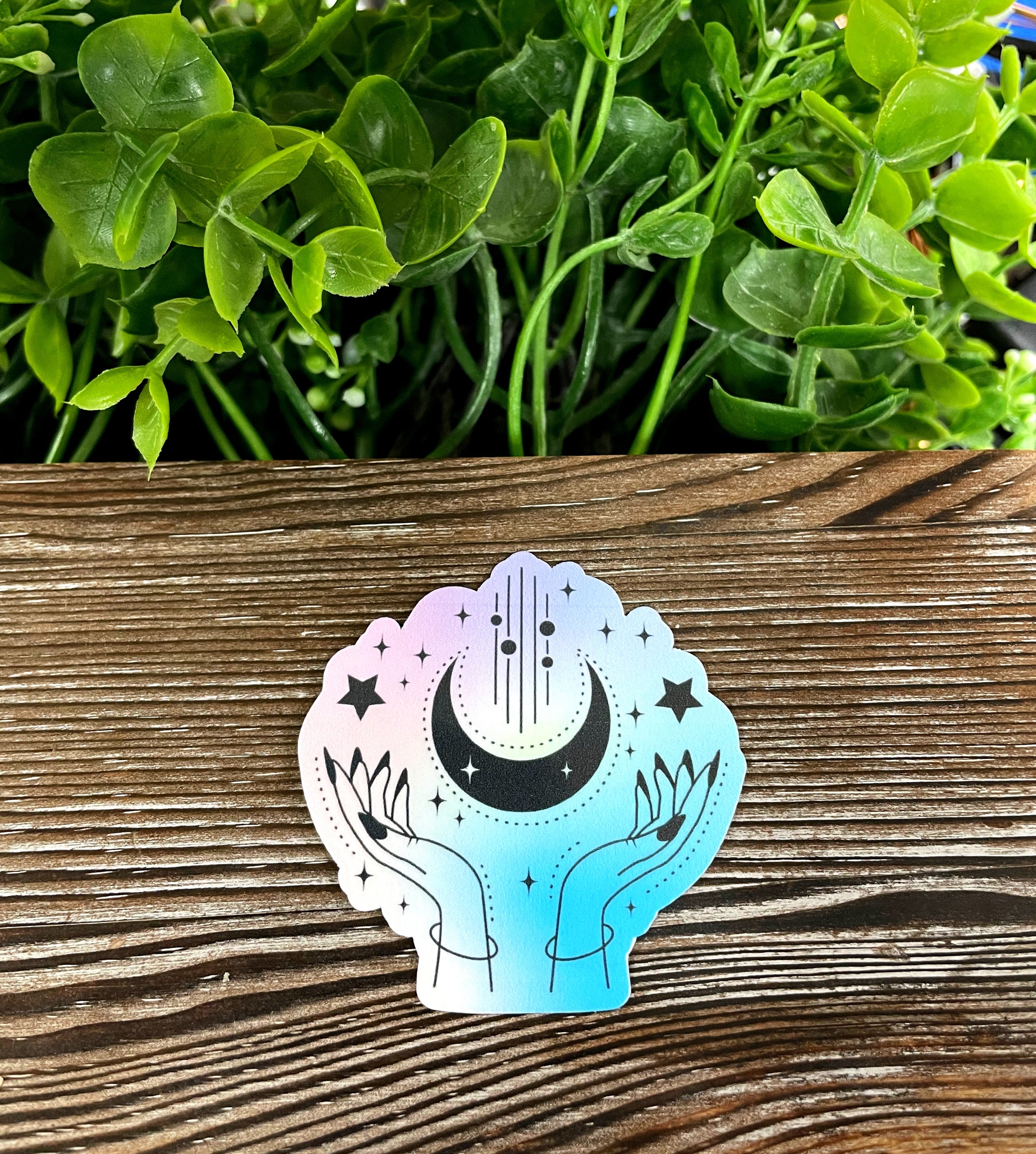 Watercolor Pastel Hands Crescent Moon die cut vinyl sticker featuring a boho design, perfect for personalizing smooth surfaces.
