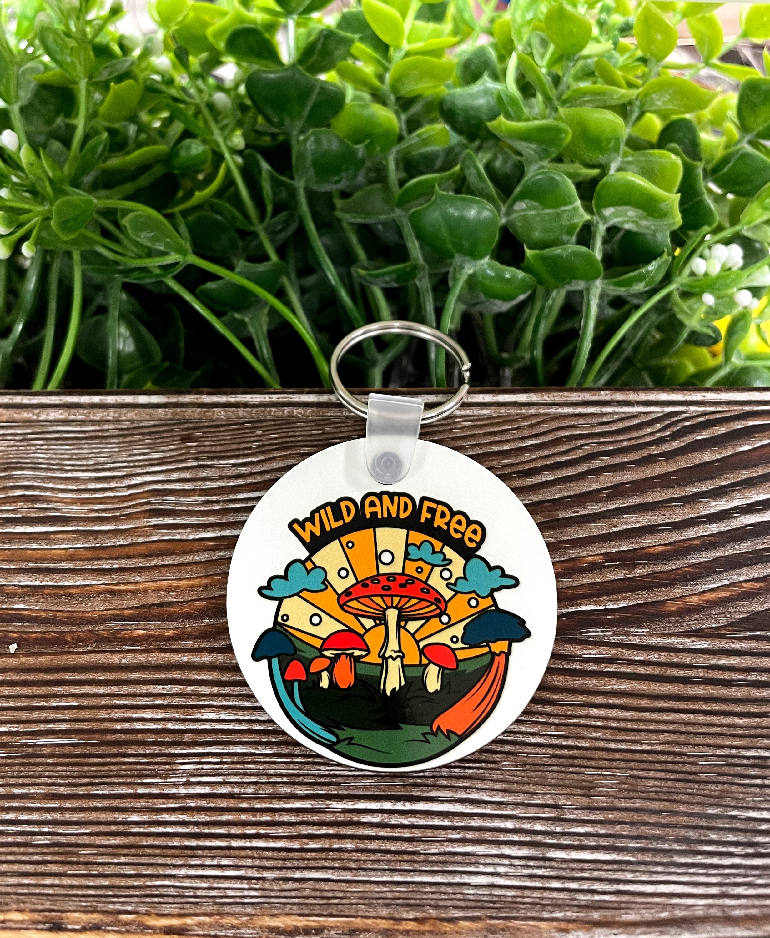 Wild and Free MDF Round Keychain featuring a boho design, lightweight and colorful, perfect for personalizing your keys.