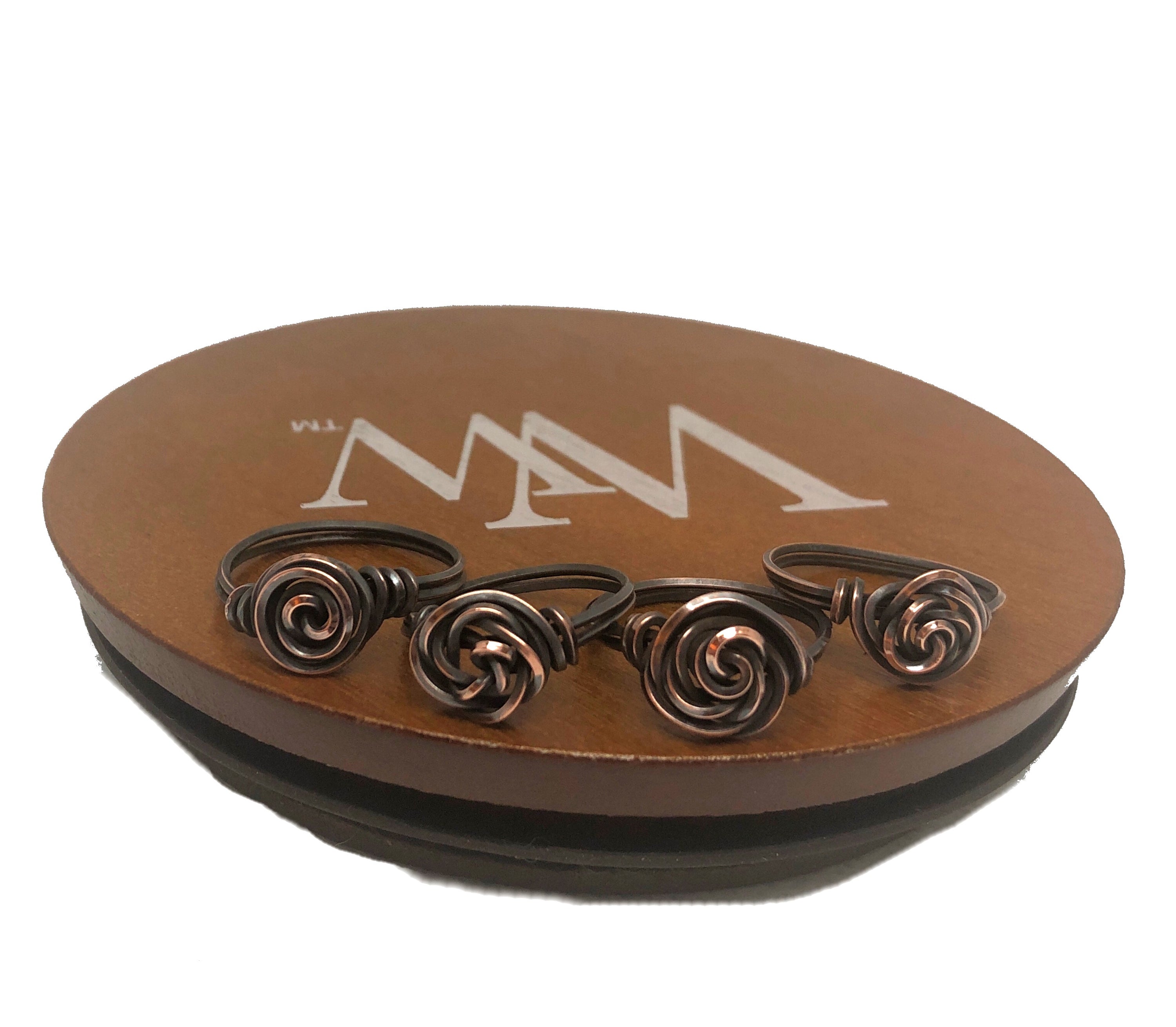 A beautifully handcrafted Wire Wrapped Copper Rose Ring featuring an intricate rose design made from oxidized natural copper wire.