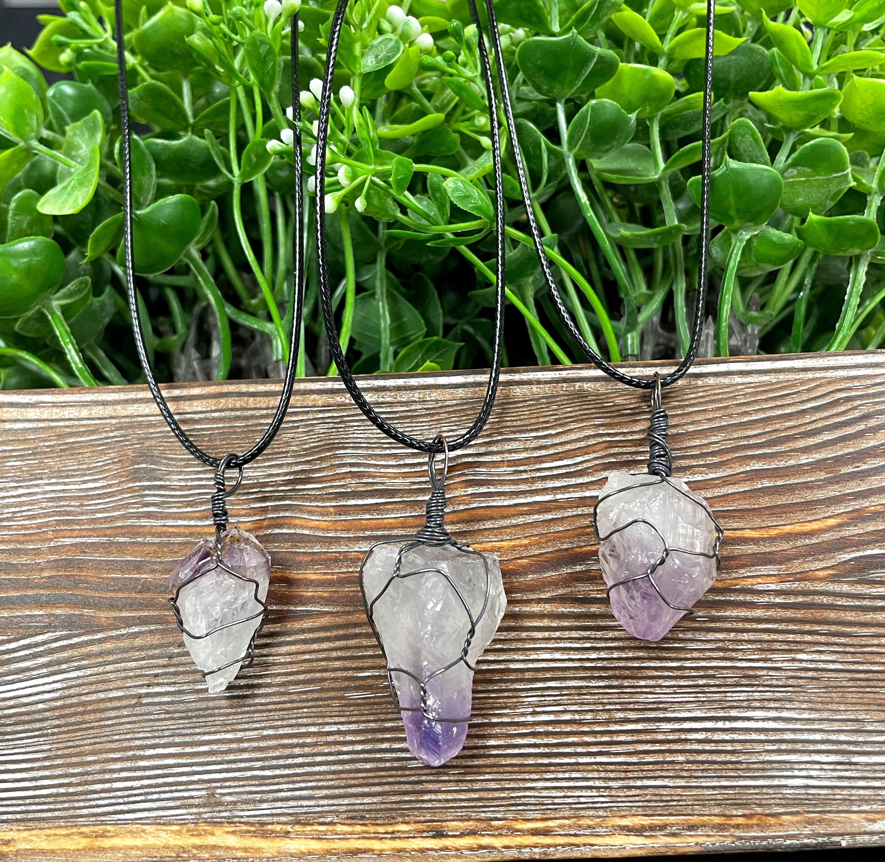 Wire Wrapped Rough Amethyst Crystal Gemstone Chunk Pendant with oxidized copper wire on a 21-inch cord, showcasing its unique purple hues.