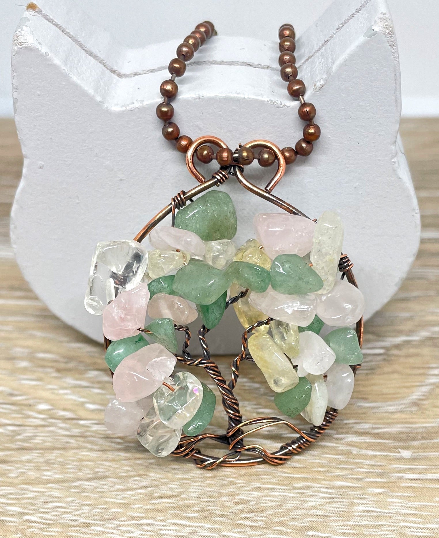 Wire Wrapped Tree of Life Pendant featuring colorful gemstone chips wrapped in oxidized copper wire, displayed on an 18-inch ball chain.