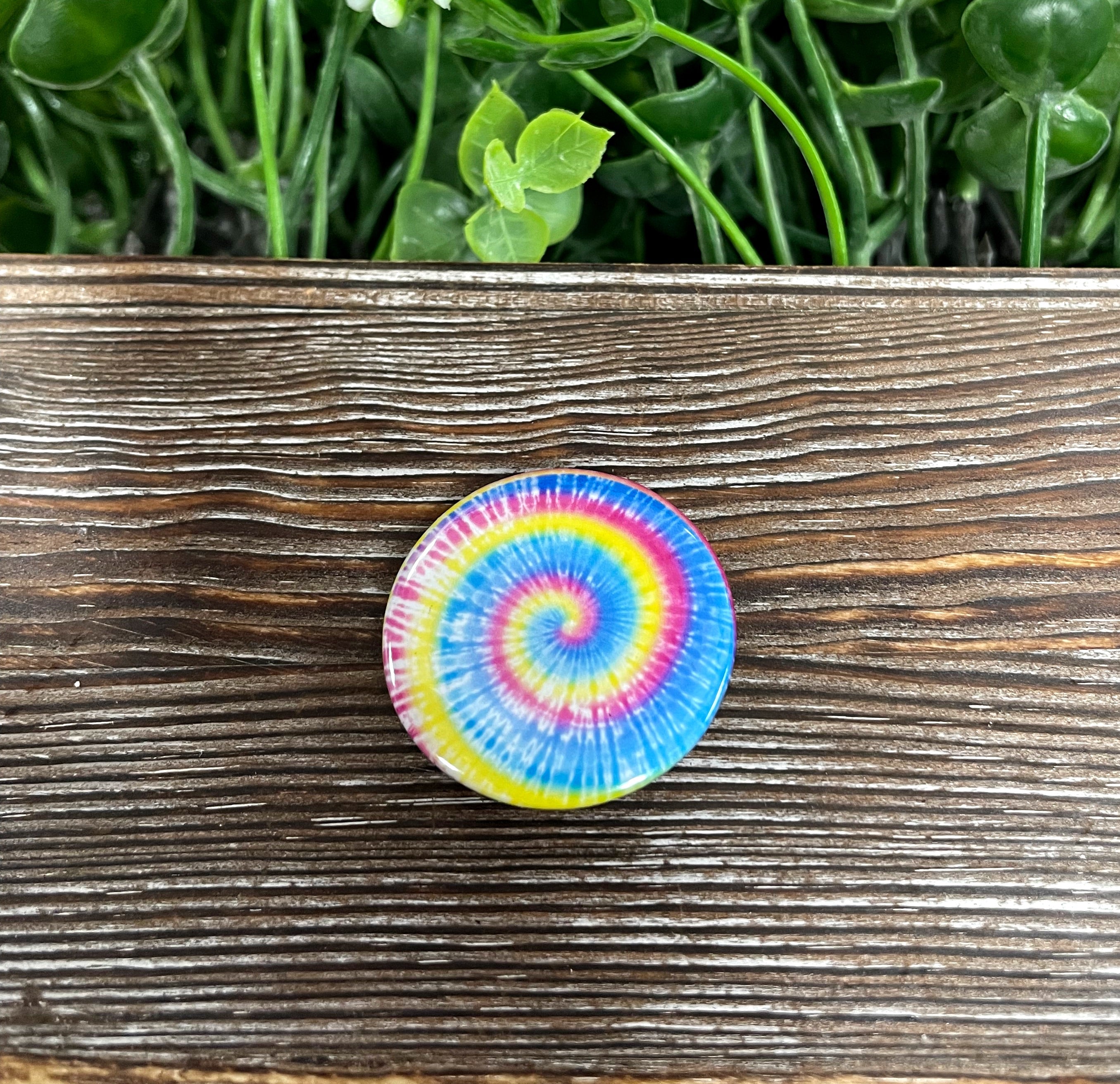 A vibrant Yellow Blue Pink Tie Dye Graphic Art Button measuring 1.25 inches, showcasing a colorful tie-dye pattern.