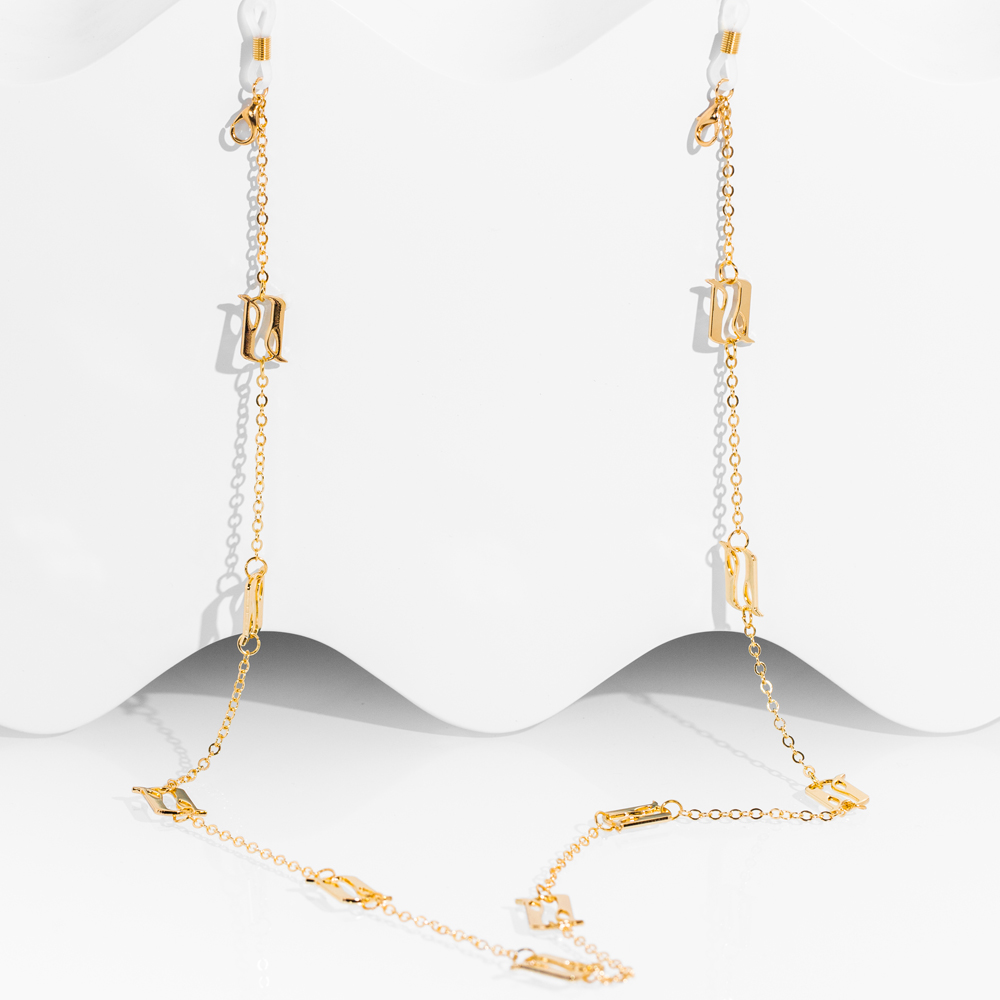 A stylish silver eyeglass-mask chain featuring the letter A adorned with clear crystals, symbolizing light and beginnings.