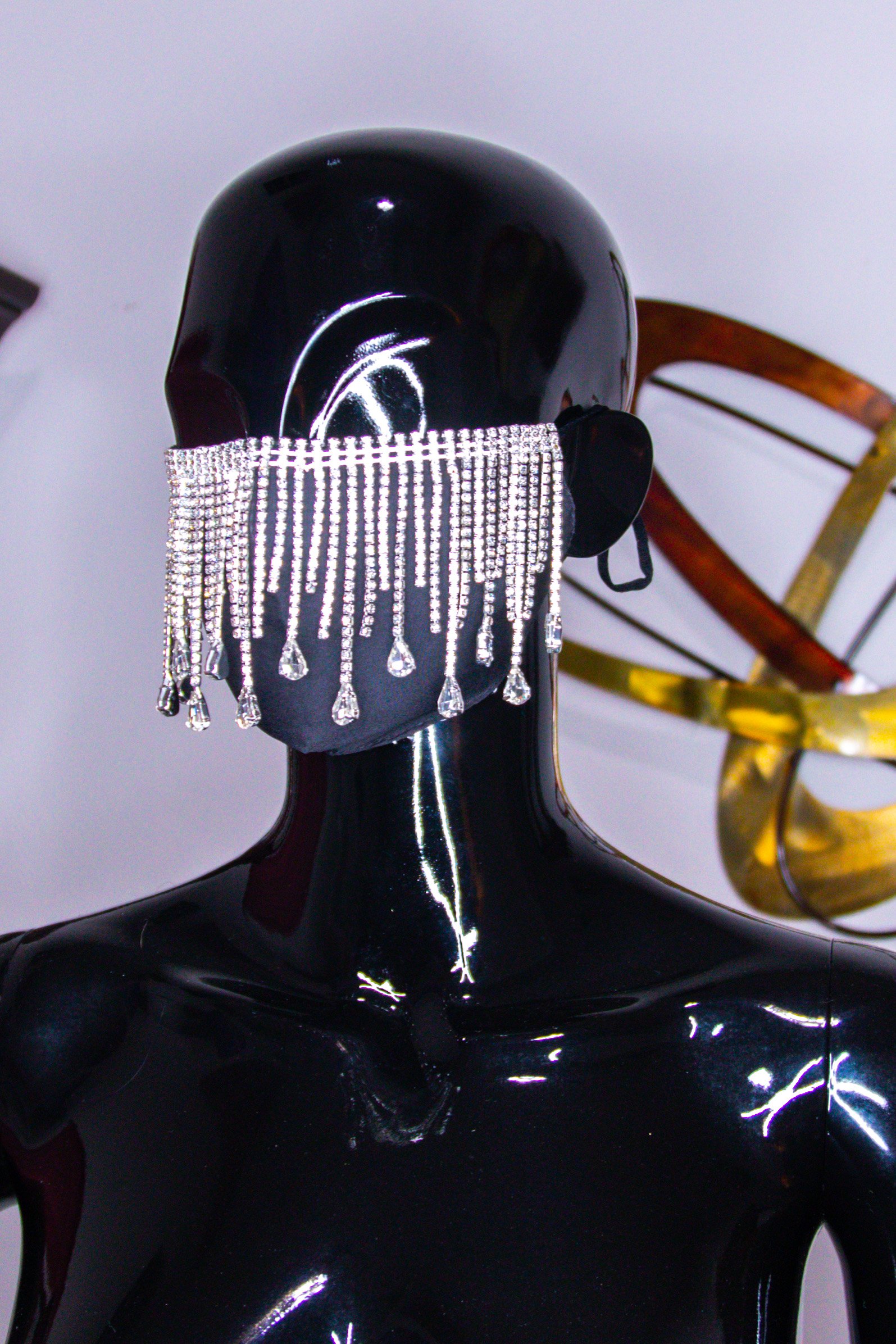 Elegant black Tuxedo Tear-Drop Mask with clear crystal tassels and tear drop stones, secured with elastic ear loops.