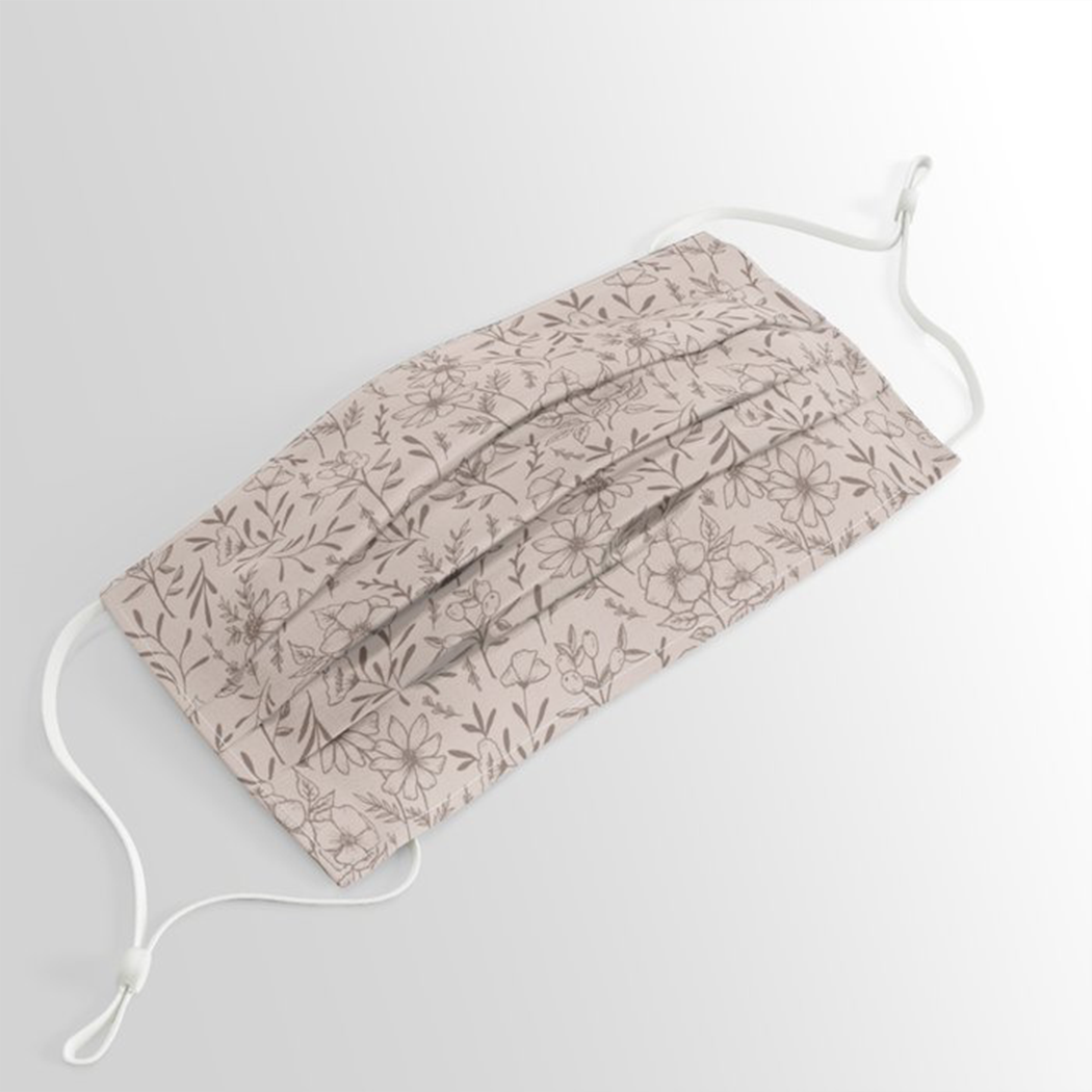 A stylish pink flower face mask with pleated design and elastic ear loops, perfect for everyday use.