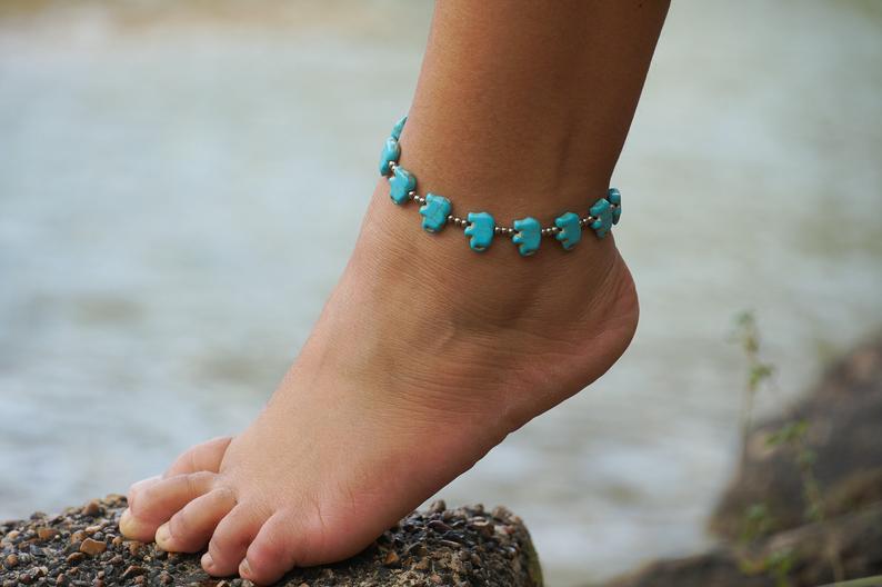 Turquoise Elephant Boho Silver Anklet featuring intricate design with silver bells and pressed cotton chords, perfect for bohemian style.