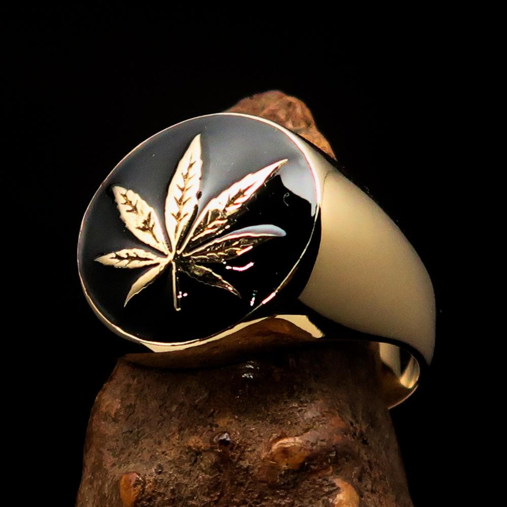 Brass Marihuana Leaf Men's Ring featuring a high-polished finish and black enamel design, showcasing its unique leaf motif.