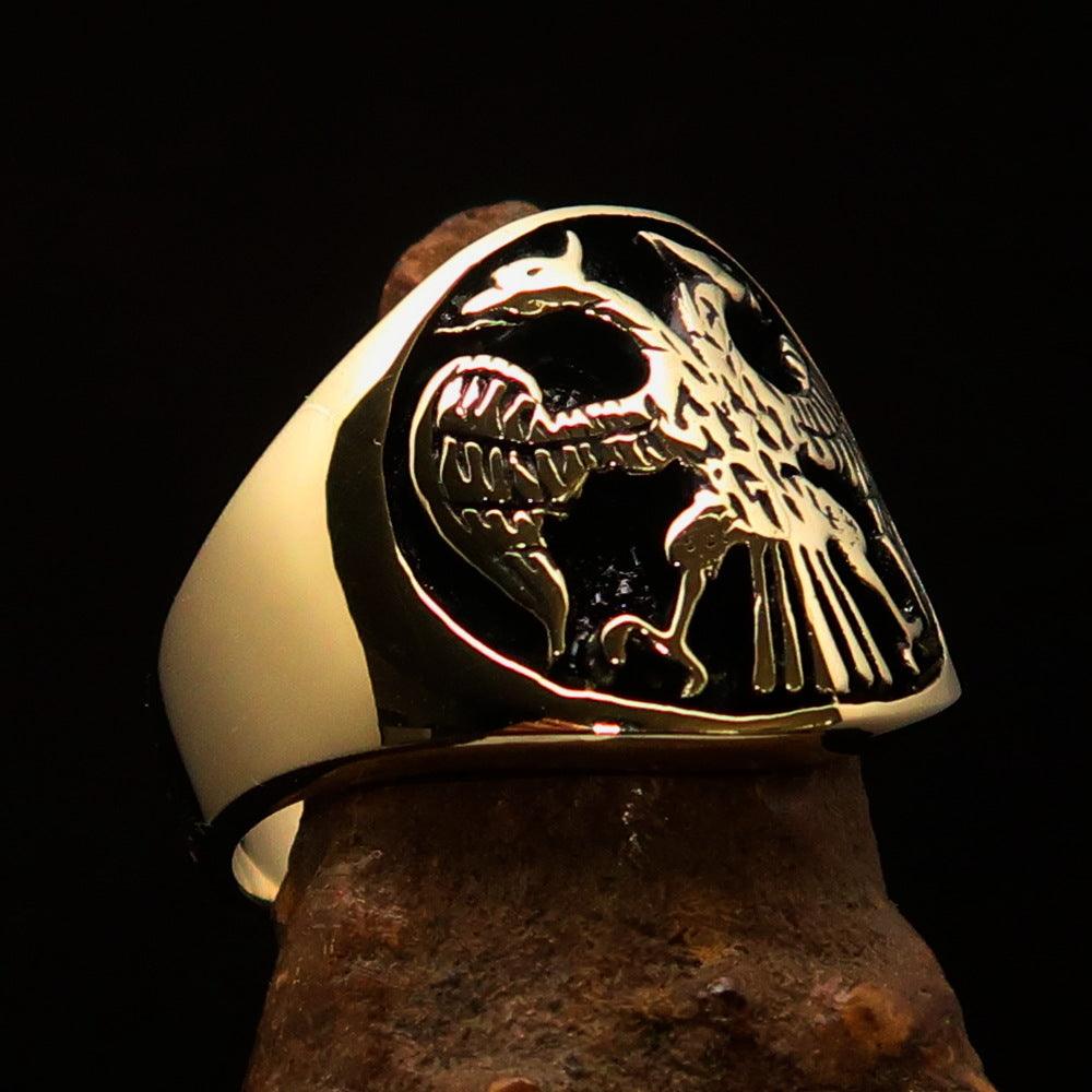 Ancient Men's Twin Head Eagle Ring in antiqued brass, showcasing intricate eagle designs and polished finish.