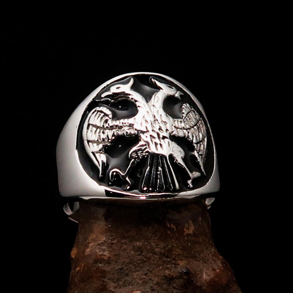 Men's Twin Head Eagle Ring in Sterling Silver with black enamel finish, showcasing intricate eagle design and polished surface.