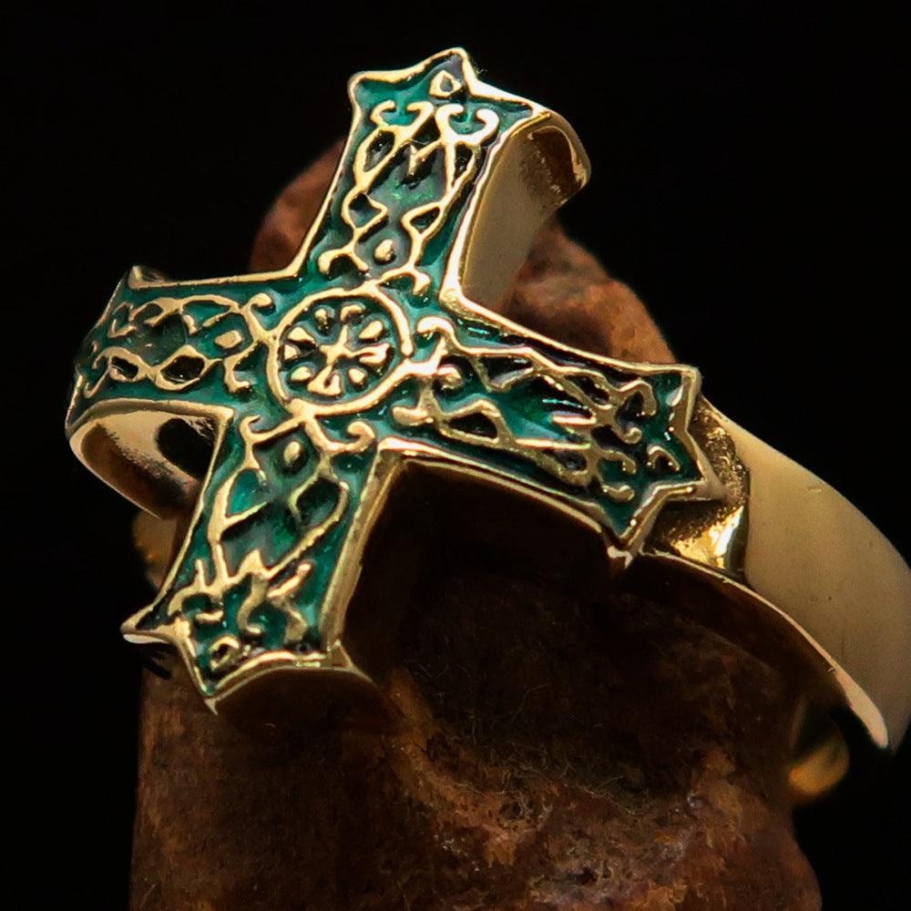 Men's ornamental Celtic Cross Ring made of solid brass with a polished finish and green enamel detailing, showcasing its intricate design.