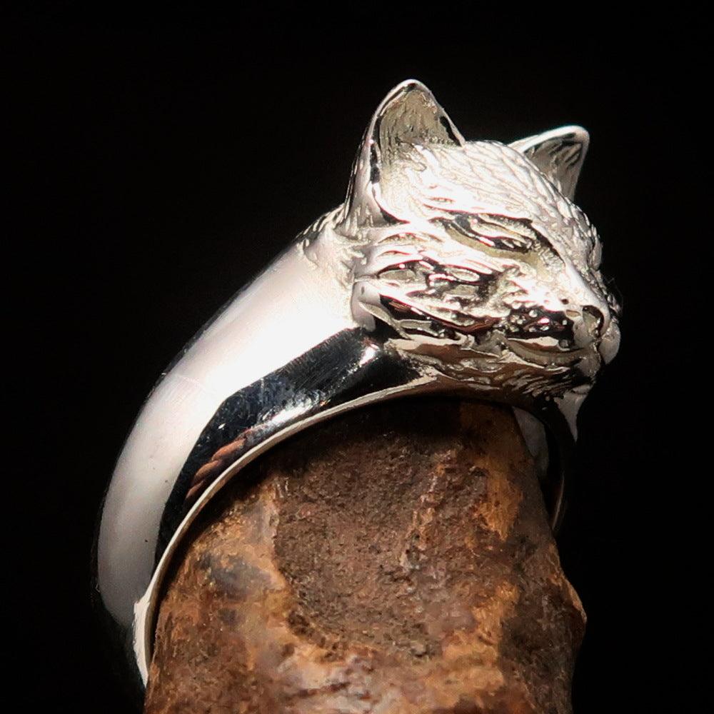 A shiny Sterling Silver ring featuring a whimsical design of a happy sleeping cat, showcasing its polished finish and intricate details.
