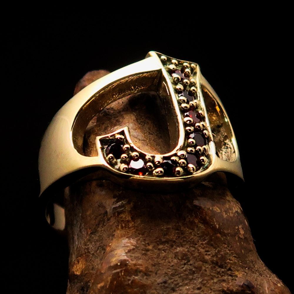 A beautifully crafted Initial Ring featuring a bold letter J adorned with 8 red Cubic Zirconias, made from solid brass with a mirror polish finish.