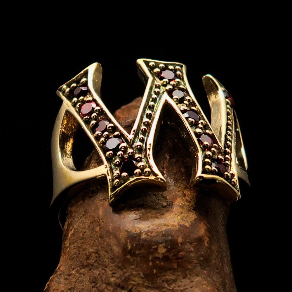 A beautifully crafted Initial Ring featuring a bold letter W, adorned with 11 sparkling red Cubic Zirconias, made from solid brass.