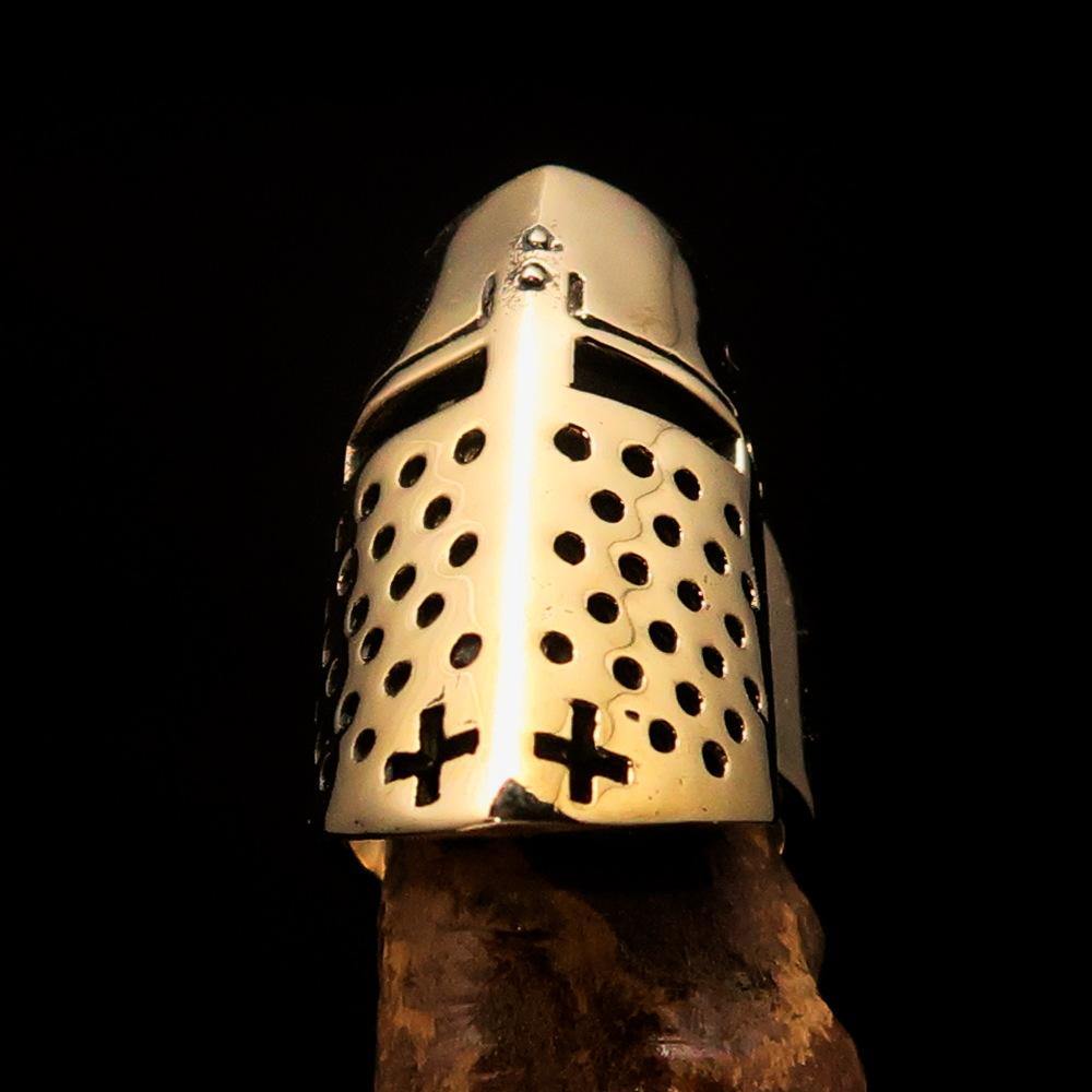 A beautifully crafted solid brass medieval knight helmet ring, showcasing intricate details and a polished finish.