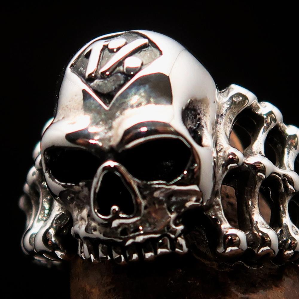 Men's 1% Outlaw Biker Skull and Bones Ring made of solid sterling silver with an antiqued finish and high polished details.
