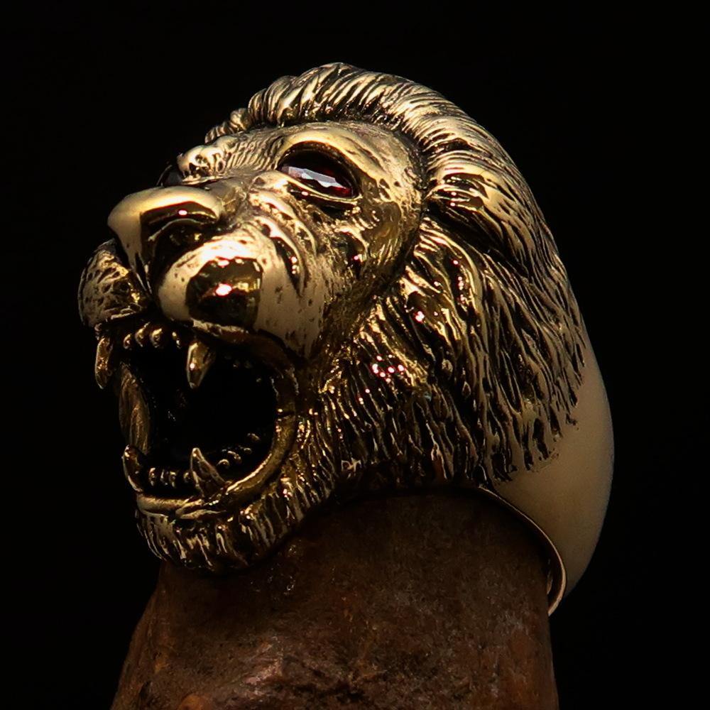 Men's Animal Ring featuring a lion design with red CZ eyes, crafted from solid brass with a high polished and antiqued finish.